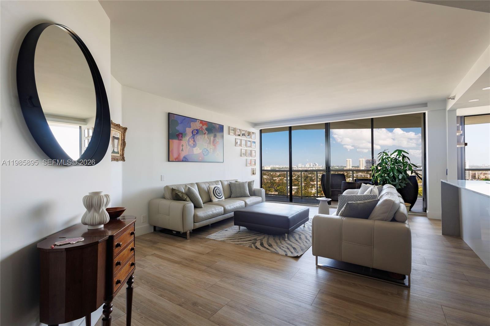 COMPLETELY REMODELED/UPGRADED North-west CORNER unit with 3bd/2 ba. Bright apartment with plenty of natural light, large balcony with UNOBSTRUCTED city and water VIEWS. Modern wood tile floors, custom built open concept kitchen with NEW stainless steel appliances. Completely renovated bathrooms. Lots of custom built closets. Laundry room w/washer and dryer. Recessed lights. Fully SMART HOME with electric blinds throughout. Extra storage room next to the apartment. THIS BUILDING WAS RECENTLY REMODELED and has 5-star amenities.