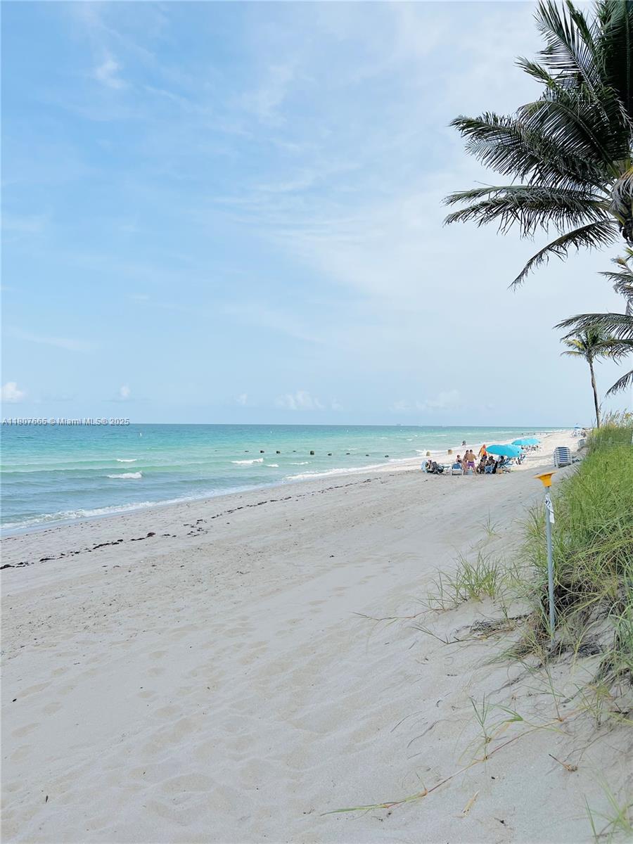 Immerse yourself in an exclusive Miami neighborhood and do not miss the opportunity to own this unique, rarely available, beach unit. Inside, discover 1,300 square feet of open concept living area, bathed in natural light and ready for personal touch. The unit features two spacious master bedrooms, each with cedar walk-in closet and private bathroom. Just beyond your doorstep, explore brand name stores at Bal Harbour Shops, enjoy events at Haulover Park, and stroll to charming cafes or fine dining restaurants. Residents of Brownstone Community enjoy access to a private beach and secluded walking trail directly across the street.   
Whether you're seeking a year-round residence, vacation getaway, or investment opportunity, this beach condo has it all. Schedule your private showing today!