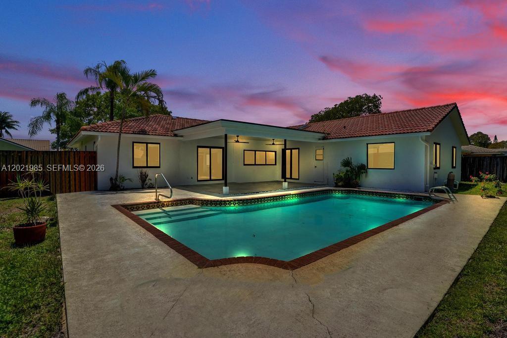 This gorgeous one story home has new kitchen and bathrooms, new floors, new light fixtures and all new windows. Huge private master bedroom on one side of the house with his & her sinks and walk in closet. Four other bedrooms are on the other side of the house including a cabana bath to the pool. The home has a large family room with skylights. A kitchen with a big island, all new appliances with windows opening to patio/pool area for entertaining. Large dining area and huge living room makes it perfect for large gatherings & celebrations. Covered back patio with fans, large pool and huge back yard for barbecue or summer kitchen. 
NO HOA which results in no extra monthly fees to worry about.