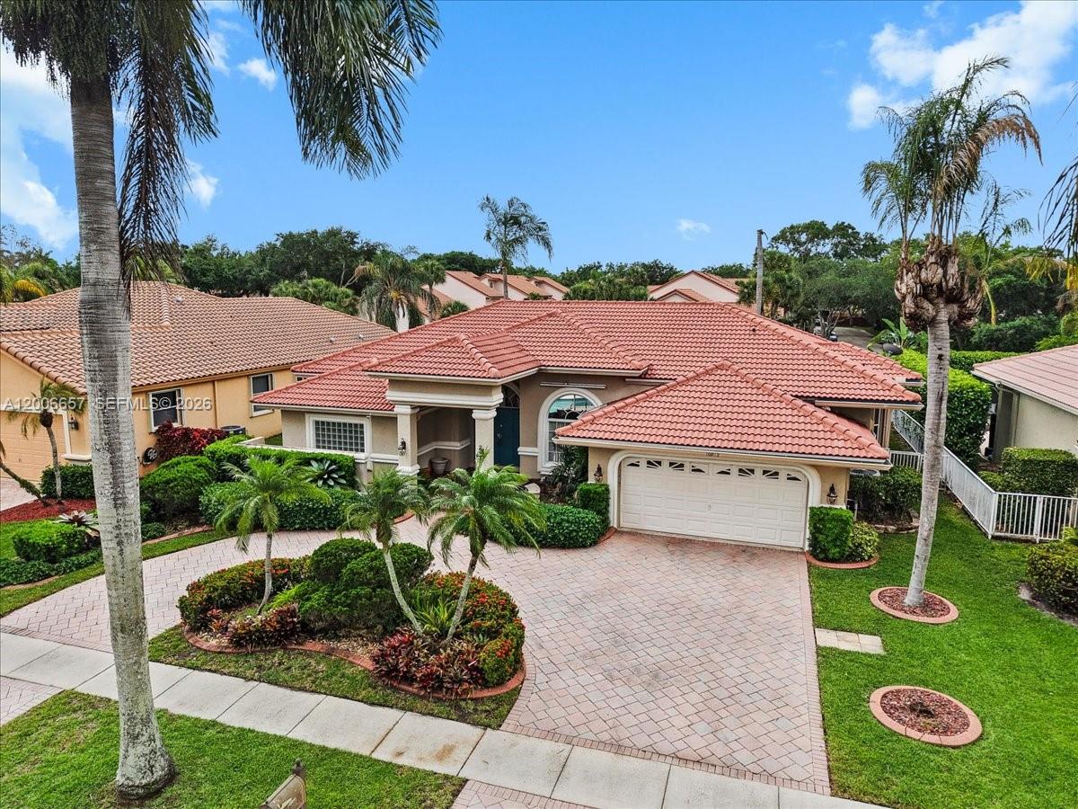 SPECTACULAR HOME IN THE PRESTIGIOUS WESTPORT COMMUNITY!  Featuring 4 bedrooms and 2.5 baths, the home offers an open, inviting floor plan with vaulted ceilings, designer finishes, and abundant natural light throughout and ample space for entertaining.The kitchen boasts (2) year old appliances and ample space for entertaining The spacious primary suite offers two walk-in closets and overlooks your private backyard oasis an expansive patio, and a beautifully landscaped setting, perfect for relaxing or hosting guests. Additional features include a 2-car garage, paver driveway, and updated systems. Ideally located near Jacaranda Golf & Country Club, Sawgrass Mills, major highways, fine dining, and top shopping destinations. Easy to show. This is a rare opportunity to own a move-in-ready, FULLY FURNISHED home in one of Plantation’s most sought-after neighborhoods. owner has an active real estate license. For showing instructions contact listing agent