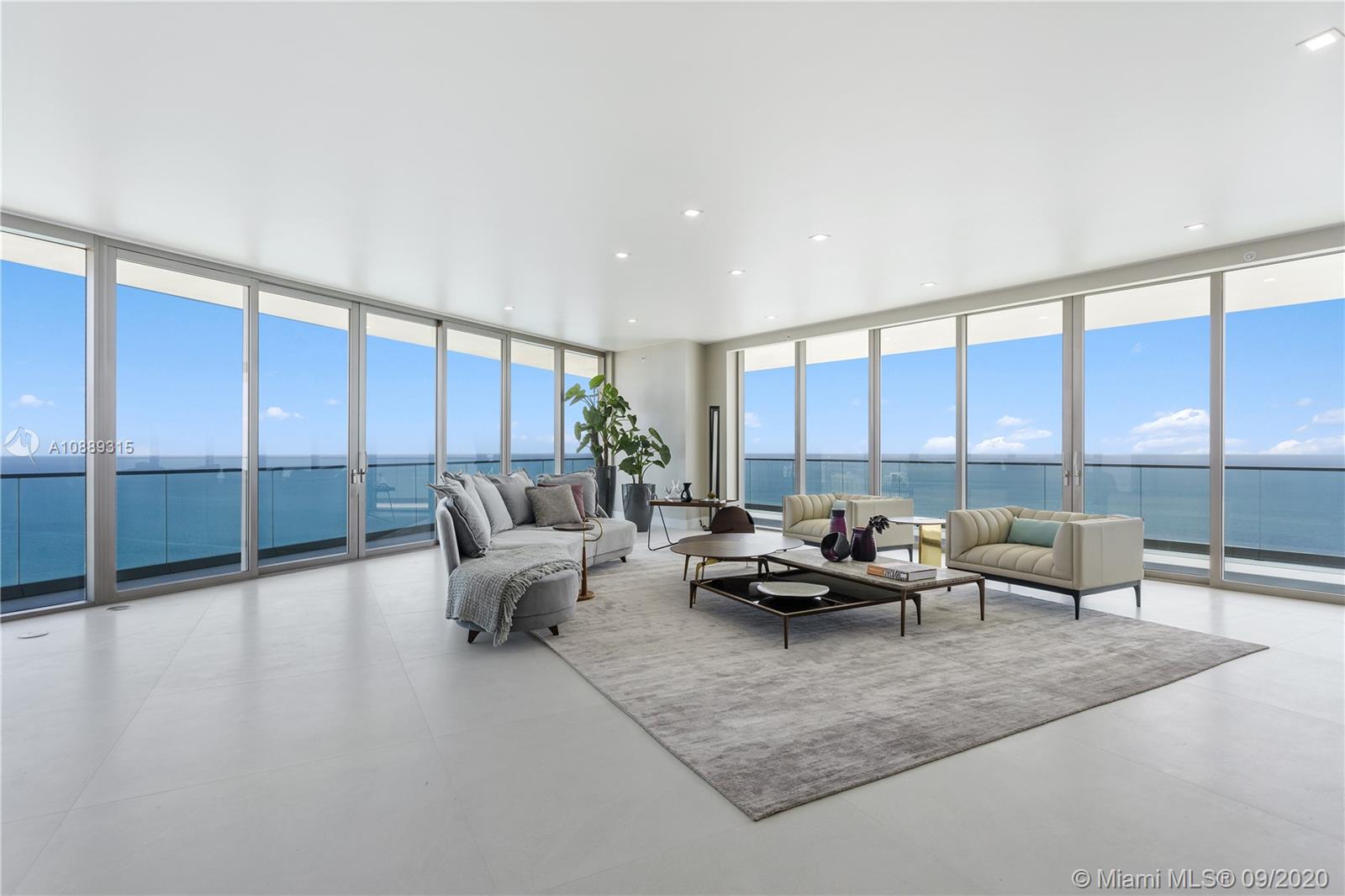360 degrees of Direct Ocean & Intracoastal views from every room. 4B/5.5B + service/laundry room. Floor to ceiling glass w/white marble stone floors throughout including the balcony. Modern kitchen w/European-designed cabinetry, white stone countertops, an island and designer appliances; Wolf ovens & espresso maker, SubZero Refrigerator & wine cooler. Master bedroom suite has a midnight bar and walk-in closet by Ornare. Master bathroom has 2 separate vanity areas & separate rain shower. Expansive balcony for outdoor living w/Summer Kitchen. 2 parking spaces. The only Armani building in the US designed by Starchitect Cesar Pelli.  35,000 Sq Ft of luxury amenities include Oceanfront resort pool + bar, State-of-the-art fitness center & Spa, children’s play area, Grand Lobby & Lounge and more!