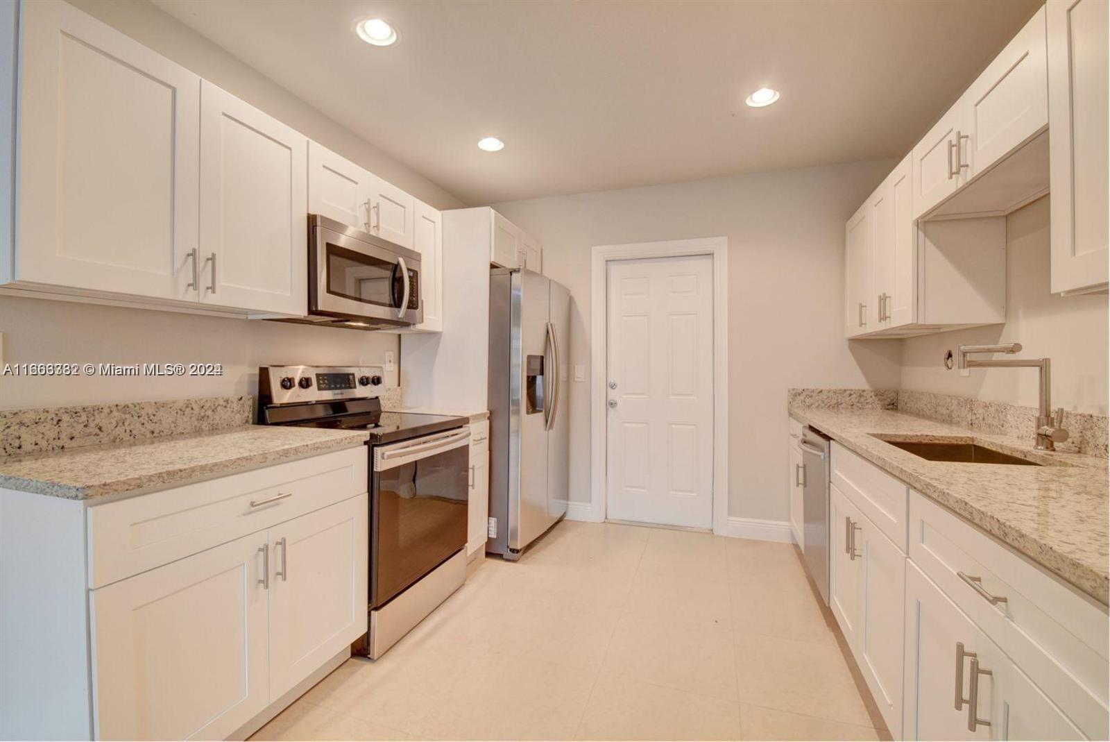 Modern and Elegant Rental in Prime Location: This beautifully updated property features porcelain tile floors, stainless steel appliances, granite countertops, and central A/C for year-round comfort. Enjoy peace of mind with a 2021 roof and hurricane impact glass windows. Freshly painted and move-in ready, it includes 2 assigned parking spaces plus guest parking. Water is included in rent! Just minutes from Delray Beach, restaurants, supermarkets, schools, and more. Ride your bike to the Ave or the beach!