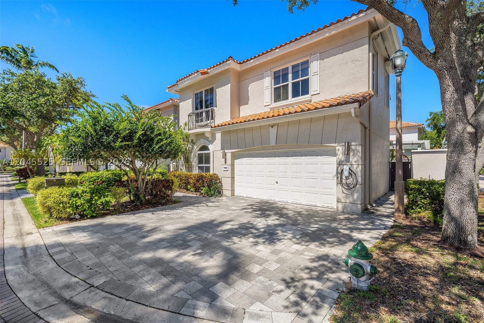 Beautifully renovated two-story home in the guard-gated Harbor Islands community of Hollywood. Offering 4 bedrooms plus a versatile den/office that easily serves as a 5th bedroom, and over 3,000 sq ft, this move-in-ready residence blends modern design with everyday comfort. The open-concept kitchen showcases dark walnut cabinetry, a marble waterfall island, and large-format porcelain flooring across the main level, anchored by a sculptural cable-railing staircase. Upstairs, the primary suite features dual walk-in closets and high ceilings. The fully reimagined backyard is built for entertaining — custom pergola, built-in outdoor kitchen, and spa. Residents enjoy 24-hour guard-gated security, tennis and pickleball courts, basketball, fitness center, clubhouse, pool, and marina — all just minutes from Hollywood Beach, Aventura, and Gulfstream. Some photos have been virtually staged.