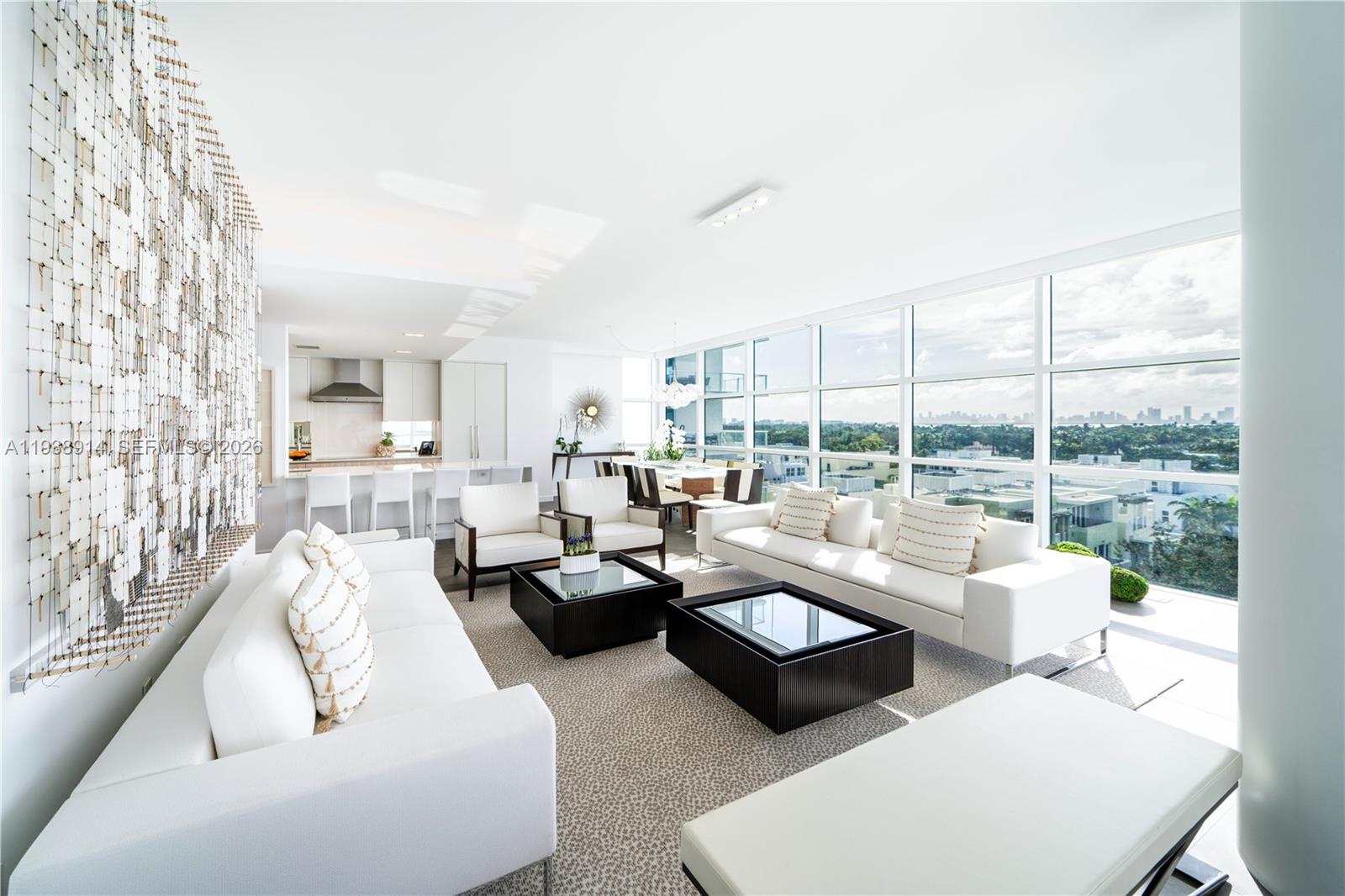 Breathtaking Sunset & Skyline Views from Private, Guard-Gated Aqua Island. This exquisite & rarely available 4BD/4.5BA corner residence offers unparalleled luxury with serene sunset, Downtown Miami skyline, golf course, & bay views. Chic & thoughtfully upgraded, the home features sophisticated interiors, high ceilings, electric blinds throughout, a newer open eat-in kitchen with a large walk-in pantry, Sub-Zero wine cooler, & an expansive great room. Floor-to-ceiling walls of glass flood the space with natural light while perfectly framing the stunning sunsets & cityscape. An art lover’s paradise, the residence boasts top-of-the-line fixtures & finishes, generous wall space for curated collections, & a layout that feels both grand & intimate. The spacious primary suite is exceptionally appointed with a large walk-in closet plus 3 additional closets, & a spa-like bathroom featuring dual vanities, a Toto toilet, & an upgraded glass-enclosed shower. Additional highlights include a tankless water heater, 2 assigned parking spaces, & complimentary valet. Residents enjoy exclusive island living with 24-hour guard-gated security, concierge services, a fitness center, & 2 resort-style swimming pools set on 8.5 acres. The community allows residents to have 2 dogs. Just one block from the beach & boardwalk, minutes from top schools, premier dining & shopping, & only 15 minutes to Miami International Airport.