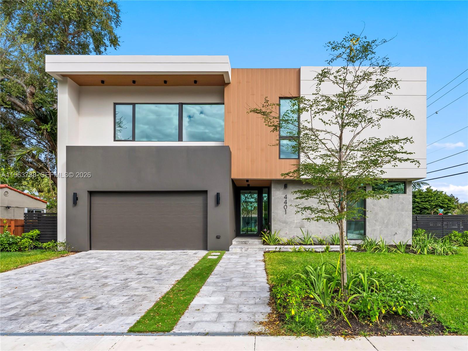 Just completed 2026 corner-lot masterpiece in Little Gables offering 4,113 total SF with 3,563 SF of refined modern design living area. This 4BR/4.5BA residence with 2-car garage and large in-ground pool delivers exceptional scale, quality, and detail rarely found at this price point. 

A fully customized Italian Scavolini kitchen anchors the home, featuring Antracita matte cabinetry, Nero Assoluto leathered granite countertops by Opustone, and a curated appliance suite: 36” SMEG induction range, wall oven, speed oven, warming drawer, dual integrated dishwashers, and panel-ready Liebherr refrigerator, freezer, and wine cooler. Kraus workstation sinks and matte black fixtures elevate both function and design. 

Floor-to-ceiling impact-rated windows and expansive laminated-glass sliding doors provide security, energy efficiency, and abundant natural light. Seamless indoor-outdoor flow connects the main living areas to the pool and private backyard. 

The primary suite is a true retreat with freestanding soaking tub, Duravit wall-mounted toilet system, linear drain rain shower, limestone and large-format porcelain finishes, custom cabinetry, and matte black designer hardware. All secondary baths feature vessel sinks, frameless LED mirrors, and premium fixtures. 

Porcelain flooring throughout, Italian interior doors, architectural exterior cladding, LED lighting, and curated material selections complete this thoughtfully executed new construction. A must see!