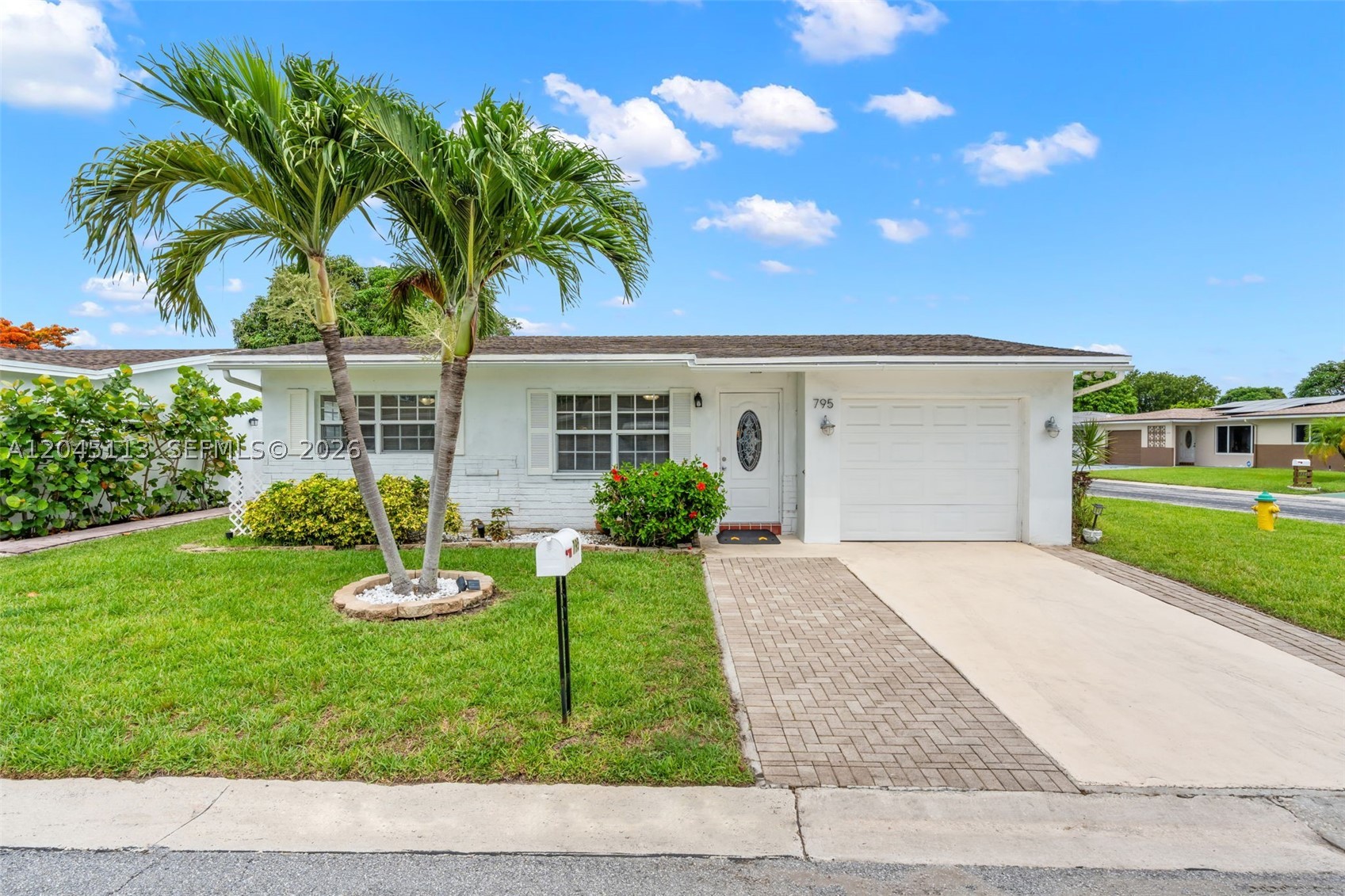 Welcome to this beautifully maintained 2-bedroom, 2-bath corner-lot home in the desirable Paradise Gardens 55+ community. This light-filled residence features an updated kitchen, impact windows, and a spacious Florida room, creating the perfect space to relax or entertain. Enjoy your own private backyard retreat surrounded by mature landscaping, plus the convenience of a one-car garage and an extended driveway for additional parking. The low HOA of just $78 per month includes exceptional value. Ideally located approximately 6 miles from the beach and just minutes from Oriole Golf Club, shopping, dining, parks, medical facilities, and major highways, this home offers the perfect blend of comfort, convenience, and the South Florida lifestyle. Don't miss this wonderful opportunity!