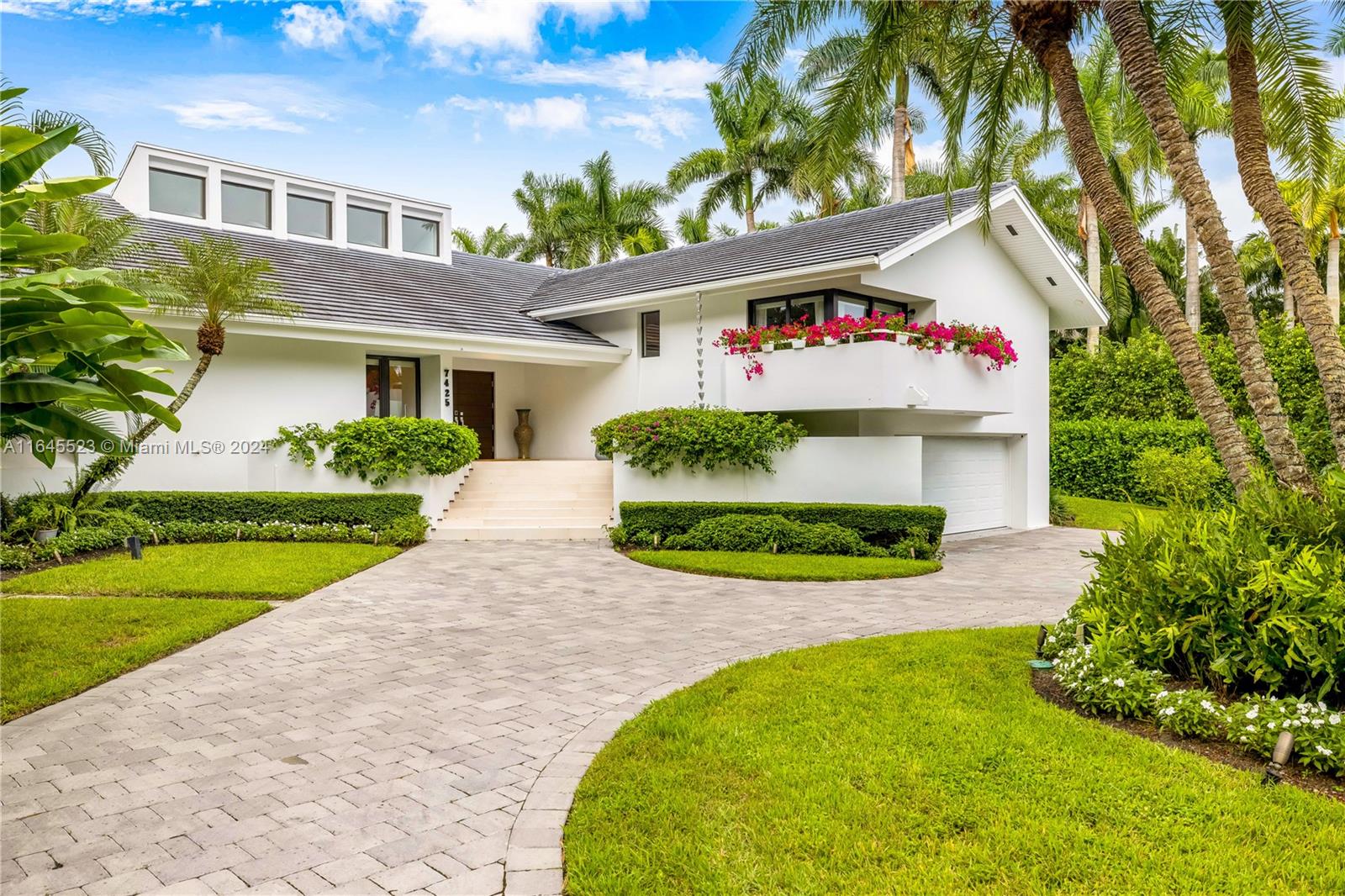 One story waterfront Jewel home exquisitely finished to the last detail. Architectural beams, open floor plan overlooking the pool & 114 ft. of waterfront. 3/4 bedrms, 5 bathrms, office + large family rm. Croatian Oak floors throughout. Kitchen w/Dell Anno cabinetry, Miele appliances, Subzero refrig, pantry & laundry rm. Hallway features a glass wine cellar that leads you to the main suite w/sliding glass doors overlooking terrace & water. The main suite w/2 separate ensuite bathrms, one w/Jacuzzi & steam bath, automatic toilets & 2 separate walk-in closets. Covered terrace w/2 BBQ’s, 1 propane,1 charcoal, icemaker & small fridge.2-car garage. Impact w/d, prop. generator. 65’ Dock.Sec1 voluntary Civic Assoc. to use tennis cts. Sec 1 Sp. Tax District.Furniture available for sale separately.