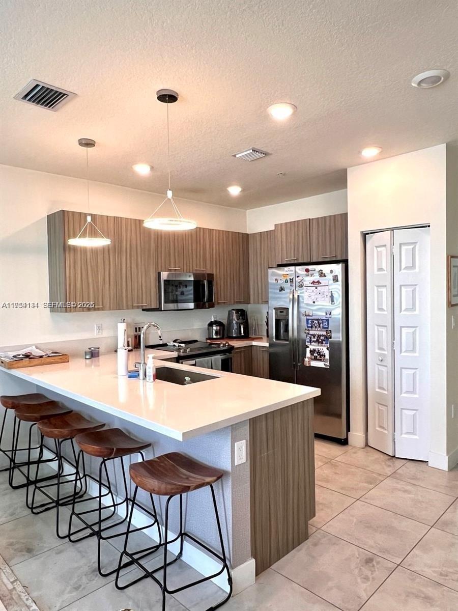 Experience contemporary living in this stylish and spacious 3-bedroom, 2-bathroom condo situated in the sought-after Landmark at Doral community. This home features an open-concept living and dining area, a sleek kitchenwith stainless steel appliances, and elegant ceramic flooring throughout. Just a short walk away, the exclusiveLandmark Club offers top-tier amenities, including a resort-style pool, splash park, tennis courts, state-of-the-artgym and clubhouse. Conveniently located in the heart of Doral, this property is close to top-rated schools, dining,shopping, and entertainment destinations.