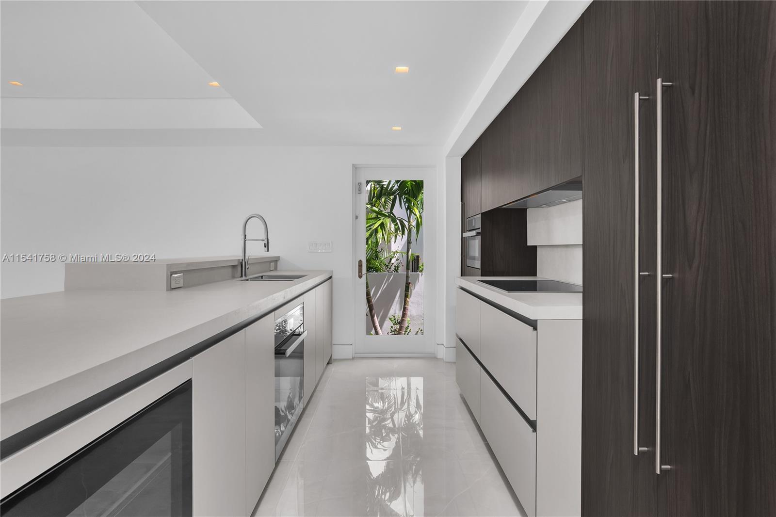 5 BEDROOM 4 BATH COMTEMPORARY RESIDENCE. This amazing home offers Italian Kitchen cabinets with top-of-the-line appliances, beautiful pool with a sheer decent feature, outdoor patio, private terraces and roof top deck. Must see!! Easy to show.