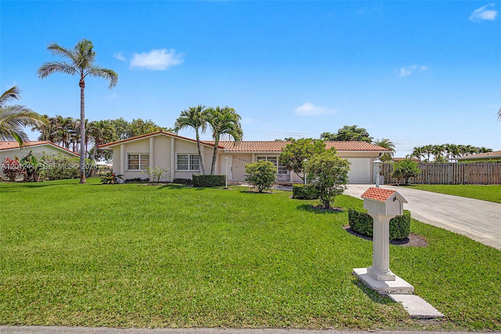 Wonderful 4 bdrm/ 3 bath canal front home in the lovely community of Pine Shores. Well-maintained with an optimal floorplan. Formal living and dining rooms. Spacious eat-in kitchen with plentiful cabinetry, gas stove, pantry and breakfast nook. Enclosed Florida room with an adjacent full bathroom, perfect for those big, extended famiy gatherings. Expansive primary suite, with large walk-in closet and bath. Indoor laundry room. Fenced backyard with patio, fruit trees and room for a pool. Plenty of space to park a boat and RV plus storage shed. Accordion & panel hurricane shutters. 2 car garage. Fantastic neighorhood!