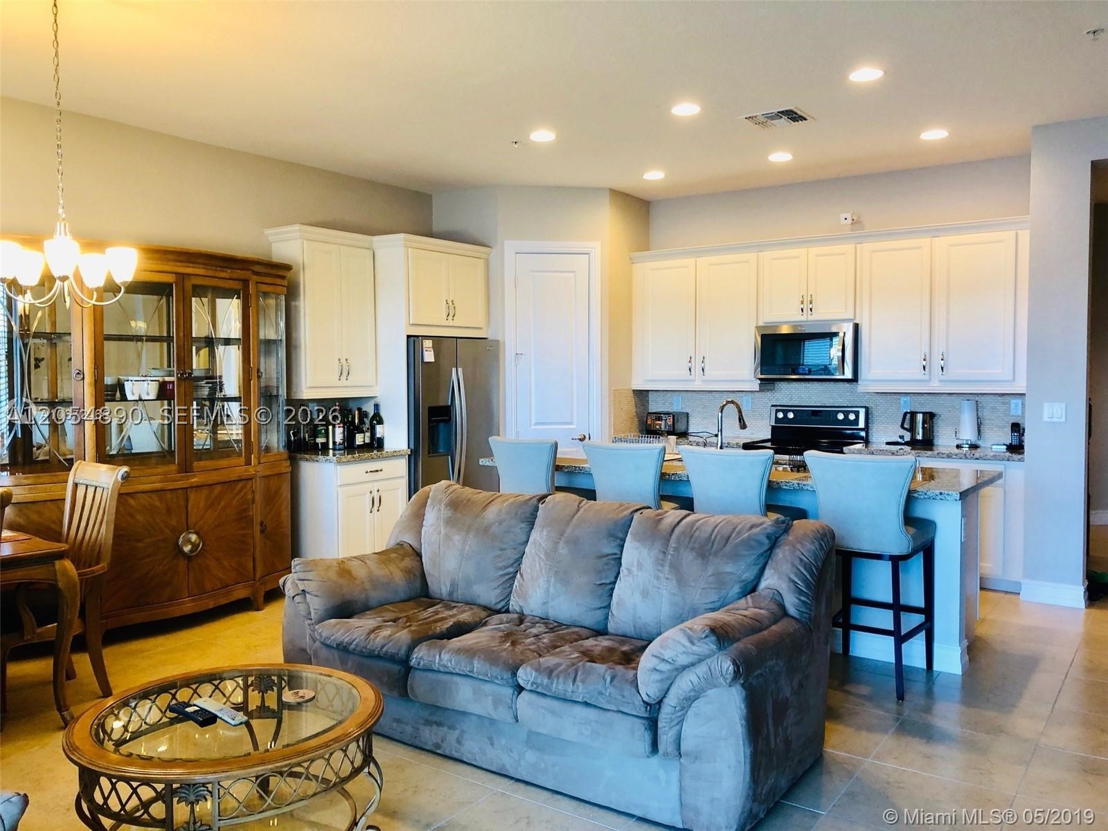 Modern, nicely kept 3 bed, 2.5 bath 2 story townhome in the beautifully landscaped Raintree at Mayfair. 2,097 SF + 2 garage & 2 driveway parking spots. Lovely open concept home has ceramic tiles downstairs & carpets in the bedrooms. Well-appointed kitchen provides SS appliances, lots of granite counter space, a center isle that accommodates 4 seats & light wood cabinets. Spacious living & dining area with great view of the lake. Master has private balcony overlooking lake and double basins, two walk-in closets and glass enclosed shower. Community has heated pool, gym and activity room with full kitchen. Well located near I75, shops, restaurants and many other services.