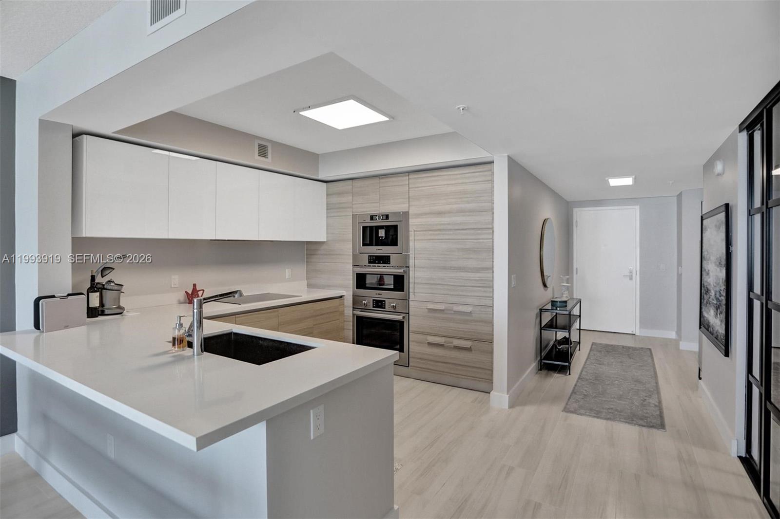 Experience luxury living at an unbeatable price in Sunny Isles Beach! Discover this stunning turn-key, fully furnished 3-bedroom, 3-bathroom condo in the prestigious Parque Towers. Originally a 2-bedroom plus den, it has been thoughtfully converted into a true 3-bedroom residence featuring a beautiful French glass door that adds elegance while keeping an open, airy feel. High-impact floor-to-ceiling windows flood the space with natural light and frame breathtaking panoramic views of the city, Intracoastal Waterway, and the Atlantic Ocean. Enjoy the spacious private terrace for morning coffee or evening entertaining. The open-concept modern kitchen boasts premium Bosch appliances, a Sub-Zero refrigerator, and a built-in coffee maker. Custom closets and motorized shades throughout provide style and convenience. Impeccably decorated with high-end Pottery Barn furniture, this home is move-in ready and offers a warm, upscale coastal living experience. Resort-style amenities include a spectacular oceanfront pool, exclusive kids’ club, state-of-the-art gym, luxurious spa, business center, and private beach club offeing chairs and umbrellas. The beach is just a short walk away. Priced as the best value in the entire building, this rare opportunity delivers luxury without the premium price tag.Perfect as a primary residence, second home, or investment property. Schedule your private showing today!