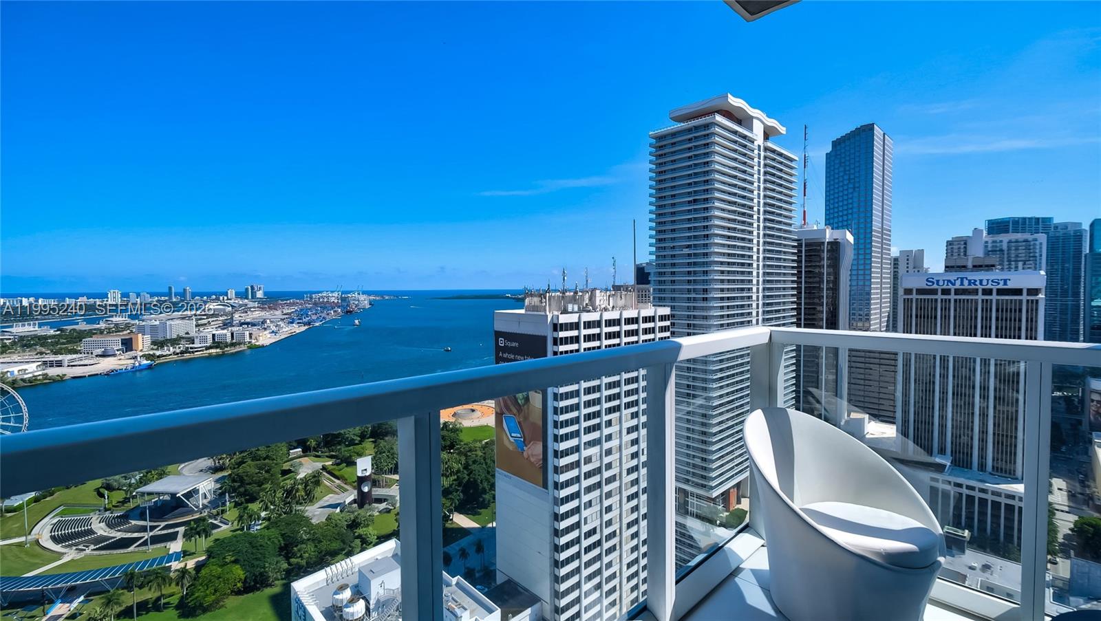 Gorgeous VIEWS - FULLY FURNISHED Corner Unit , with 2 balconies , both South AND East Exposure, direct Bay and Downtown views, 2 Bedroom + 2 Baths + Den (complete bedroom set up w/queen size bed), washer & dryer, assigned covered parking, 24/7 valet and security, walking distance to Miami arena, banks, restaurants, 100,000 SQFT amenity deck on the 8th floor, 4 pools, tiki bar and grill area, fitness center, steam room, sauna, treatment rooms, yoga, exercise, business center, theater and more!  Just bring your suitcase! Pets allowed. HOA Fee includes Special Assessment amount of $460.00.