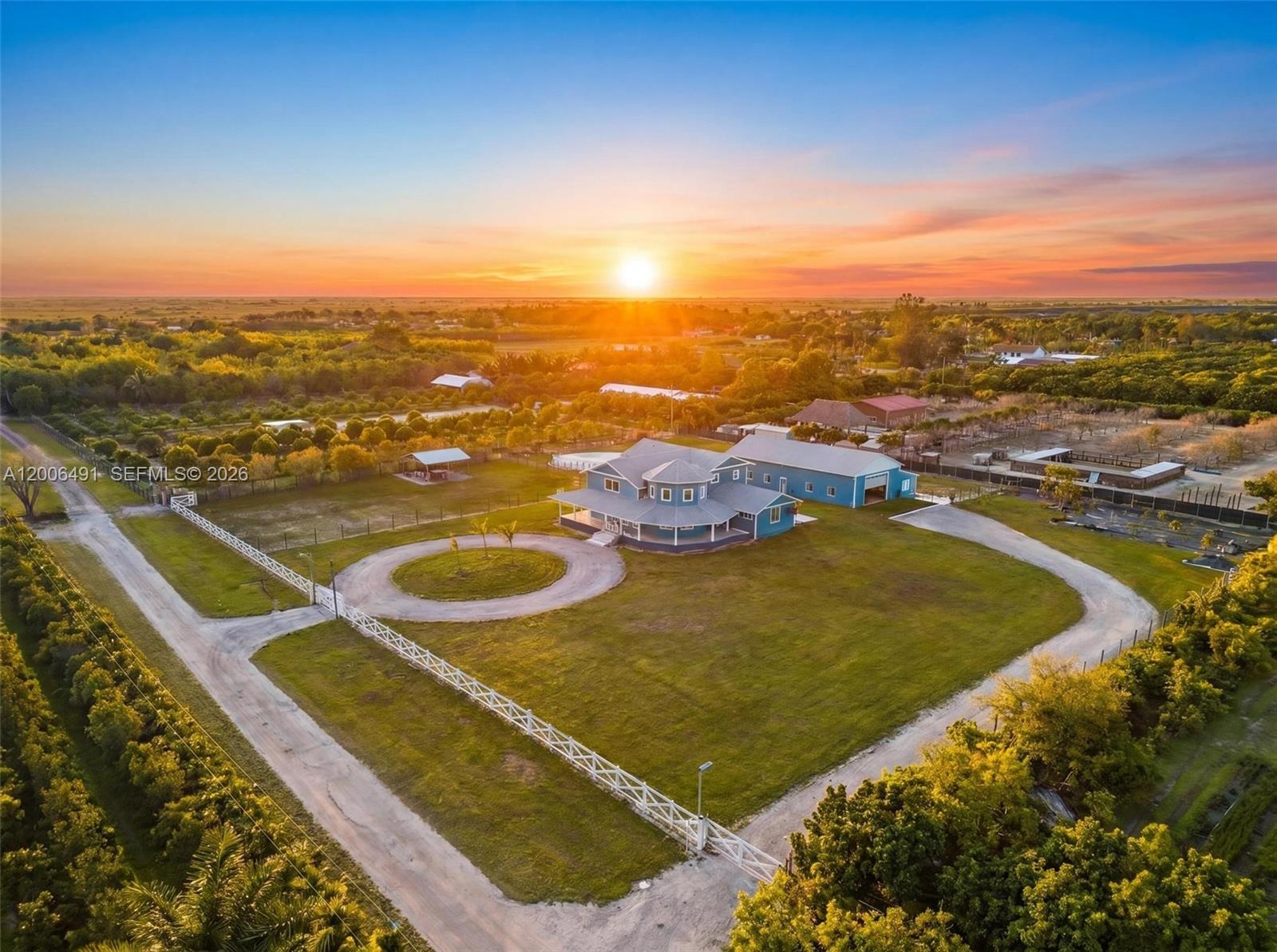 Welcome to a private equestrian retreat in the heart of the Redland, set on approximately 2.23 acres of beautifully maintained grounds. This impressive estate offers over 4,400 square feet of living space with 4 bedrooms, 3.5 bathrooms, and expansive open living areas designed for effortless entertaining. The home features impact windows and doors throughout, LifeProof flooring, fully renovated bathrooms with glass enclosures, a newly added guest half bath, an upgraded laundry room, and three new AC systems.

The property is thoughtfully designed for equestrian use and includes a fully reconstructed barn with two horse stalls, custom stall doors, a climate controlled tack room, feed and storage areas, automatic water system, lighting, and fans. Additional amenities include a round pen with sand footing, a 24×24 insulated horse shade, new horse-wire fencing, separate paddocks, and a custom wood front fence with two gates with automatic openers.

The landscaped grounds showcase a Royal Palm lined entry, leveled and usable land, concrete access areas, turf installations, and two paved driveways. A detached garage and workshop offers upgraded electrical, a full bathroom, dog wash, and multiple air-conditioned spaces. This turnkey estate delivers exceptional Redland equestrian living.