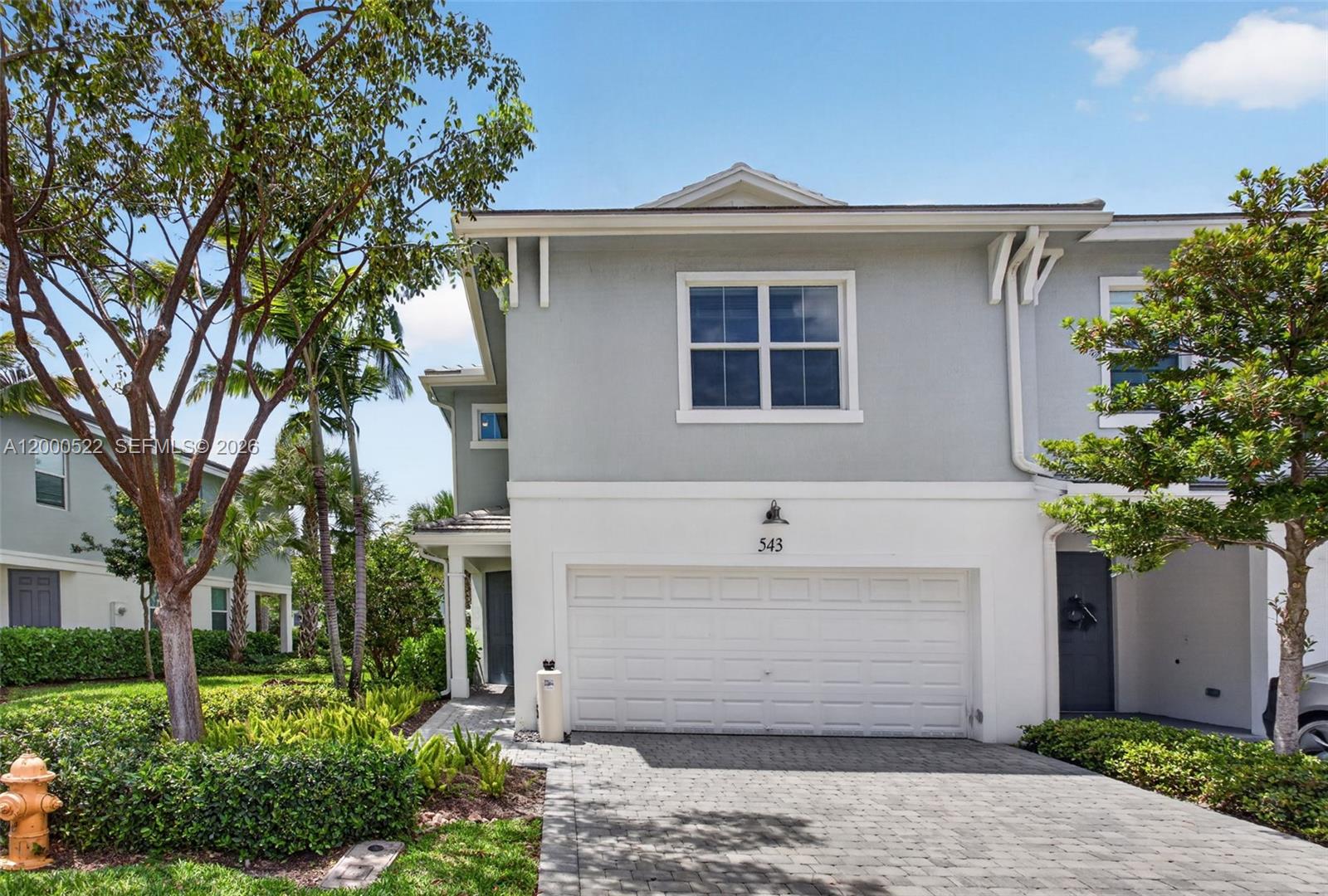 This exceptional corner-unit townhome offers 3 bedrooms, 2 full bathrooms, a first floor half bathroom and a 2-car garage, combining modern style with the comfort of newer construction. Designed with today’s lifestyle in mind, the open-concept floor plan is bright and inviting, featuring impact windows and contemporary finishes throughout. The chef-inspired kitchen showcases sleek quartz countertops, stainless steel appliances, and high-quality wood cabinetry, flowing seamlessly into the spacious living and dining areas-ideal for entertaining or everyday living. As a corner residence, the home enjoys added privacy and natural light, along with a large fenced-in backyard-perfect for relaxing, hosting, or enjoying outdoor space that’s hard to find in townhome living. This unit comes with a full house water filtration system! Residents of Sandpiper Pointe have access to a community pool, state-of-the-art fitness center and playground. Conveniently located just minutes from major shopping, dining, grocery stores, and Deerfield Beach’s beautiful beaches, this home offers the perfect blend of comfort, style, and convenience.
