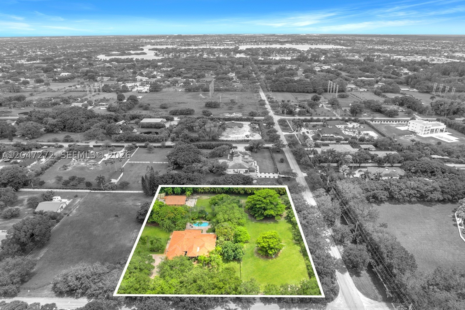 Opportunity to live on this spectacular fenced-in corner lot parcel in Southwest Ranches. 4 bedroom + office, 3 bathroom estate offers the perfect blend of country living and modern comfort with a split floor-bedroom plan. Elegant spaces with formal living, dining and family rooms with large windows and French doors overlooking the backyard. Spacious kitchen features distressed white wood cabinetry, stainless steel appliances, wine cooler, granite counters, island, coffee-bar area, countertop seating and breakfast nook. Primary suite offers a spa-like bathroom with a jetted tub, double vanities, step in shower and walk-in closets. Impact glass, central vacuum system, Tesla EV charger and 2 car garage. Outside you will find an incredible outdoor living area featuring a covered patio, summer kitchen, refreshing pool and spa, and lush tropical landscaping designed for relaxing and entertaining. Beyond the backyard, the expansive grounds continue with a 6 stall horse barn, paddock riding area, chicken coop and plenty of room for horses and other farm animals. Whether you are an equestrian, hobby farmer or simply looking for privacy and open space, this exceptional property offers endless possibilities in one of South Florida's most renowned towns.