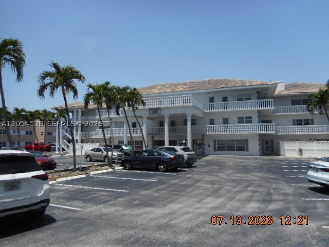 Sold "AS-IS""Where-IS" Great opportunity to live across the street to your deeded beach. This 1st Floor 2 bedroom 2 full baths with extra high ceilings in your enclosed patio over looking the pool. This unit is a corner unit with the parking spot right in front of your door.