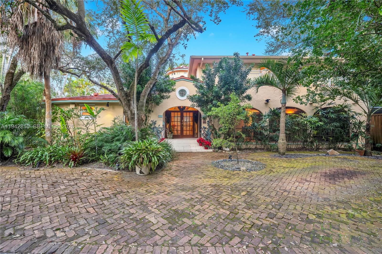 Discover the perfect blend of historic charm and modern luxury offering a 6-bedroom, 4.5-bathroom estate in Miami’s coveted North Grove. Located in the exclusive King Park neighborhood, this 3,292 sq. ft. residence has been meticulously renovated to offer the ultimate South Florida lifestyle. Step into an expansive open-concept floor plan bathed in natural light. This home preserves its 1940s architectural soul while featuring premium luxury flooring and structural enhancements. Safety and efficiency are paramount, with high-impact windows and doors installed throughout. Situated on a lush 6,550 sq. ft. lot, the exterior is a "secret garden" oasis. The manicured landscaping provides total privacy for the large patio and balconies—perfect for al fresco dining. The property also features a shaded carport and an expansive paved driveway.