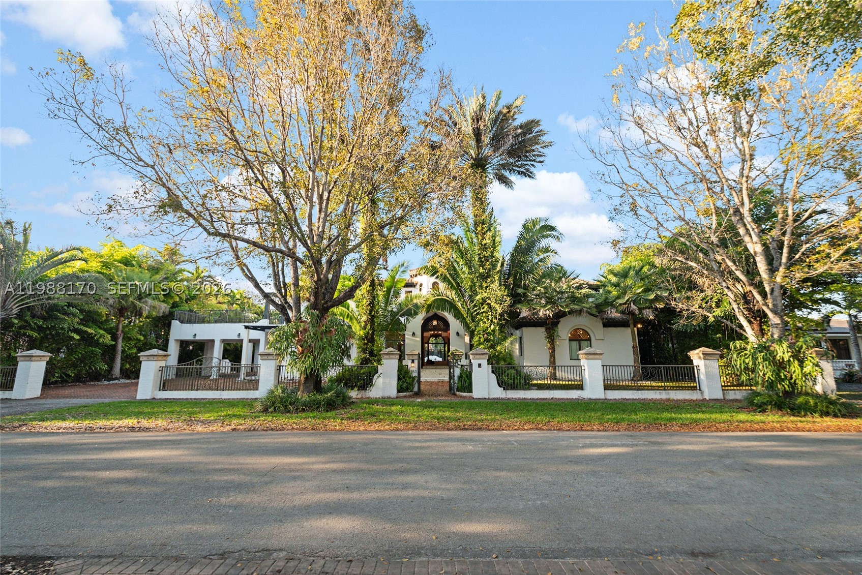 Set on one of Coral Gables finest tree-lined streets, this custom Mediterranean estate is a rare find. Built in 2002, this 6BD/5BA/2HB residence offers 6,887sqft of thoughtfully designed living space on a 19,750sqft lot. The architecture speaks for itself a hand-carved mahogany entry door, soaring octagonal rotunda w/hand-painted ceiling mural, Marble columns, Marble floors throughout and a monumental carved travertine fireplace. The grand living room opens through French doors to a covered loggia with Resort-style living outdoor space, creating a natural flow between interior and exterior that defines true South Florida living. The chef's kitchen is well-appointed with pool views and generous workspace. The expansive primary suite overlooks the pool area and opens directly to the backyard through French doors, offering generous closet space and a serene private retreat. Two kids suites connect through a shared loft play/study space rarely found. A dedicated fitness room with all equipment included, maid's quarters and 2-car garage complete the interior. Outdoors, a cascading waterfall pool, travertine deck and private turf sports court complete the grounds. Minutes to dining, shopping, Historic Miracle Mile and the iconic Biltmore Hotel. This Grand Estate delivers a refined contemporary lifestyle in the heart of Coral Gables. Schedule your tour Today!