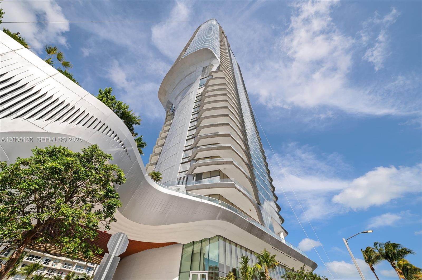 Discover sophisticated waterfront living at UNA Residences in this brand-new 3-bedroom, 3.5-bath home perched on the 26th floor. The beautifully designed residence features an expansive layout and floor-to-ceiling glass that captures breathtaking southeast views of Biscayne Bay, Coconut Grove, and the open horizon. Thoughtfully appointed with  flooring throughout, the home showcases a sleek, fully equipped kitchen with premium Gaggenau appliances. The spacious living and dining areas extend effortlessly onto a generous terrace, creating a seamless indoor-outdoor experience ideal for both everyday living and entertaining. UNA Residences is a newly completed, architecturally striking waterfront tower offering a refined lifestyle where residents are immersed in a truly exceptional amenity experience, highlighted by three resort-style pools, a cutting-edge fitness center, and a spa concept curated by the chairman of Aman. Privately set within an exclusive enclave in Brickell, UNA offers a rare sense of calm and seclusion while remaining effortlessly connected to the energy of Brickell, Coconut Grove, Downtown Miami, and the pristine beaches of Key Biscayne.