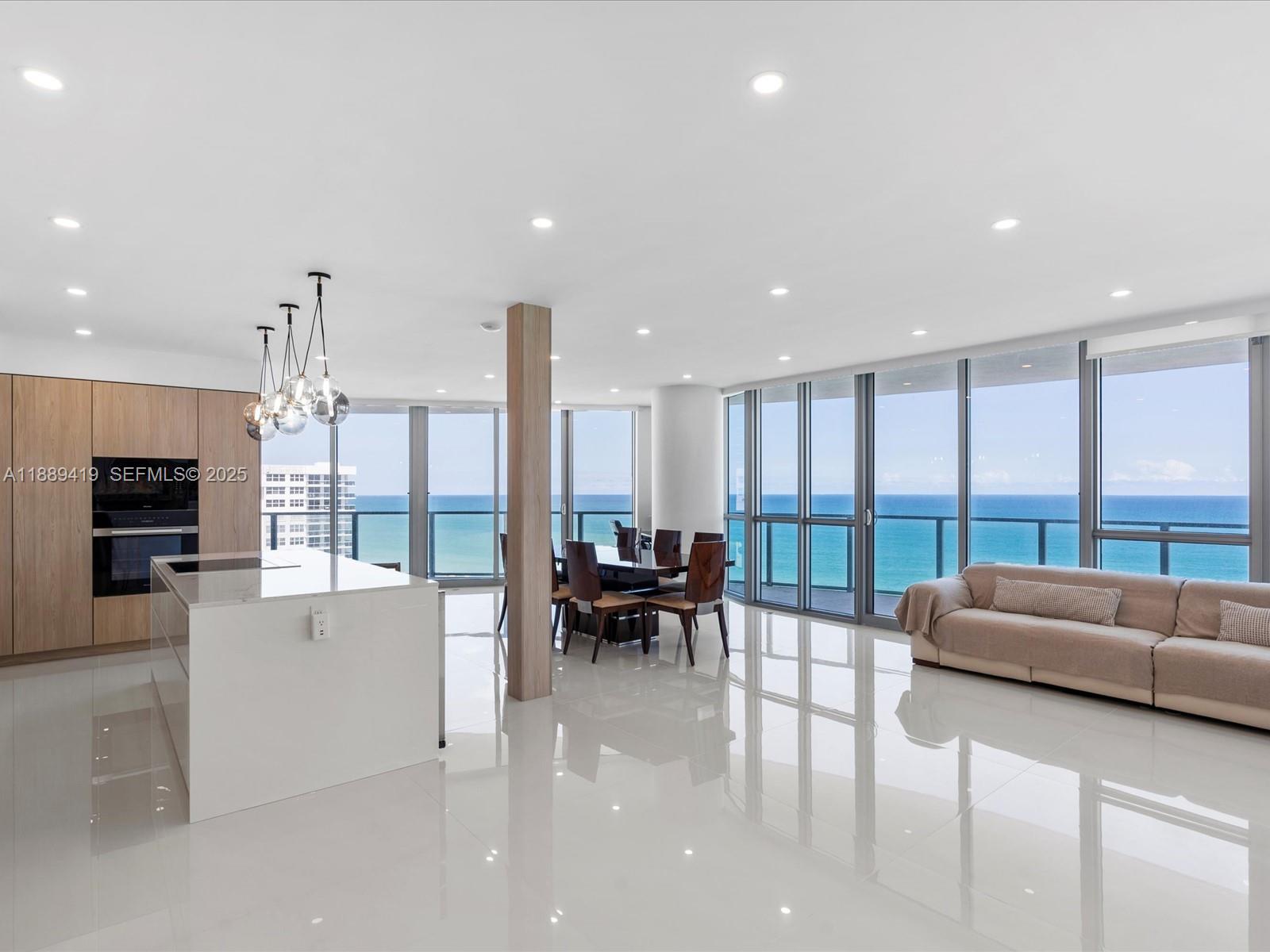 Completely remodeled direct oceanfront residence at Ocean Palms. 3,091 sq. ft. interior + 513 sq. ft. balconies. Beautiful Italian slab tile floors throughout, custom bathrooms with European fixtures, master bath with double vanity, tub, glass shower, and walk-in closets in all bedrooms. Leicht German kitchen with custom cabinetry, quartz counters, Miele appliances incl. induction cooktop and retractable downdraft vent. Two new AC units. Three balconies with ocean, city & Intracoastal views. Amenities: resort-style pool, 2-story fitness center, spa, party & billiard rooms, movie theater, tennis court, BBQ area, 24/7 security, valet. Apartment includes 2 garage spaces & storage.