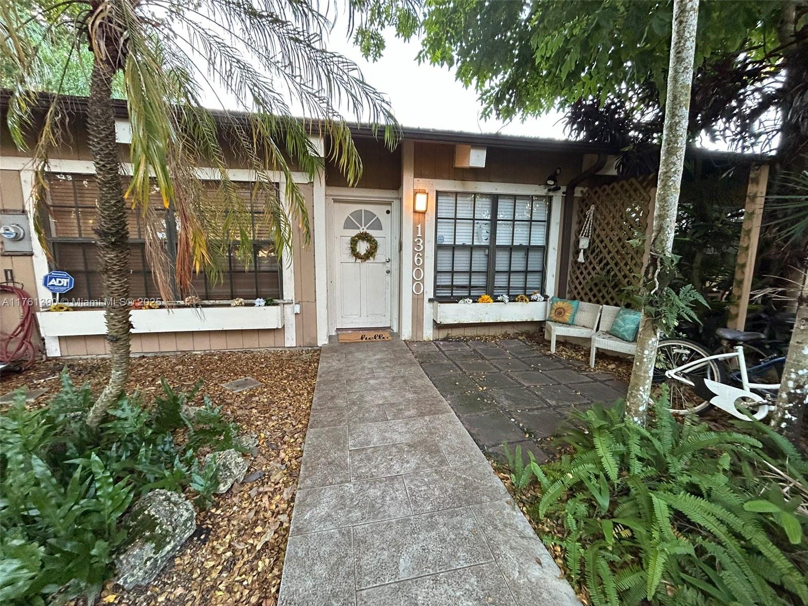 Opportunity to buy the one & ONLY CORNER VILLA , available AS- IS in Cindi's Place; West Kendall's best kept secret . property features 1200 sq ft of living space. 2 beds 2 Bath PLUS LOFT   , vaulted wood ceilings , Coral rock fireplace , built in book shelves , open kitchen with SS appliances . Exterior features include a 2018 roof , large screened patio . 2 car driveway. Seller's very motivated !!!