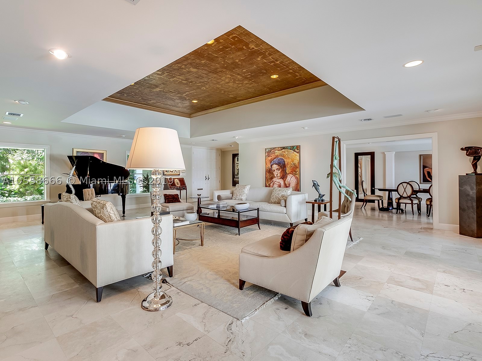Enjoy an elevated vantage point atop Old Cutler Bay waterfront lot w/long, wide water views, snug harbor, prevailing breezes & exceptional privacy! Classic Miami Minimalist fully renovated in 2005. L-shaped footprint enhances pool/channel panoramas & affords dbl the outdoor covered living space w/morning sun/afternoon shade. Tiered patios hem seawall, wood dock & lift. Spacious interiors; marble & wood flrs. Gorgeous coffered living rm; formal dining rm; gourmet kitchen & adjoining family rm; game rm w/pool-access bath — all boast water views. En suite bdrms w/walk-ins; 2nd-flr Master suite crowns the resort-like sanctuary & commands ultimate water views. This handsome tropical estate embodies the SoFla waterfront lifestyle in highly desirable gated Old Cutler Bay.