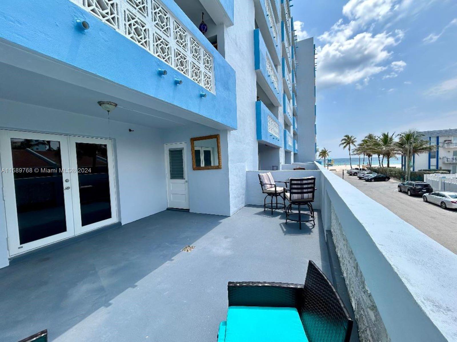 Just look at this amazing patio, larger than some rooms you've seen (available ONLY on this floor of the building). Like sunbathing without leaving your home? Gardening? Entertaining? Unique apartment converted into 2 bedrooms right on Hollywood Broadwalk. Recently remodeled in beach inspired theme, with new hurricane proof doors/windows. Tons of storage. This boutique building of only 36 units has completed its major renovation, so you can enjoy quietness interrupted by nothing but the sounds of the waves. Heated pool on the roof with phenomenal panoramic views. Or walk down (no elevator necessary!) to the beach, go for a bike ride, stroll to the restaurants and live entertainment of Margaritaville. Garage parking. Totally furnished, ready for a new long term tenant.