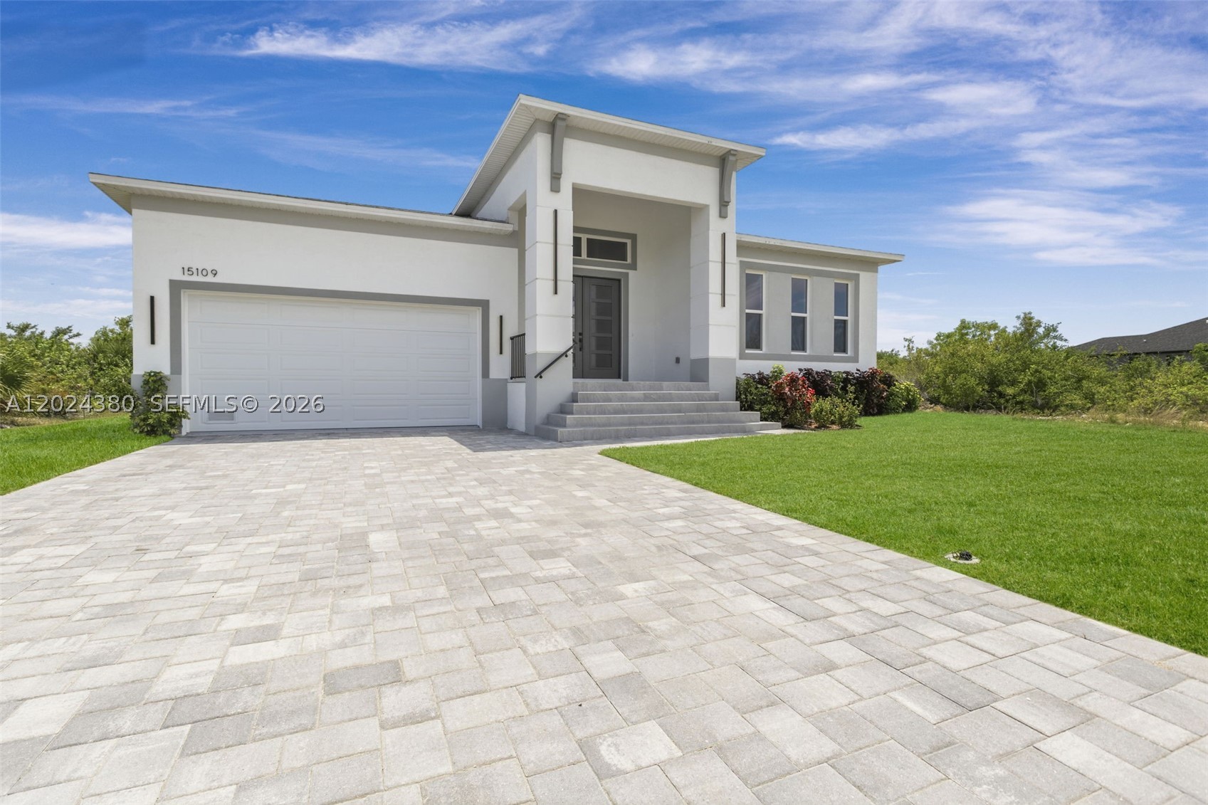 Welcome to your slice of Florida paradise in the highly desirable South Gulf Cove community—where there is no mandatory HOA and endless opportunities for coastal living. This beautifully designed, move-in-ready home offers 4 bedrooms, 3.5 baths, a 3-car (tandem) attached garage, and 2,660 sq ft of thoughtfully crafted living space, perfectly positioned on a spacious lot in a welcoming residential setting. From the moment you enter, you’ll appreciate the impressive 12-ft tray ceilings and expansive open-concept layout, which create a bright, airy atmosphere throughout the main living areas. Elegant 8-foot interior doors, high baseboards, and contemporary trim details add a refined architectural touch. The gourmet kitchen is a true centerpiece, featuring quartz countertops, a large island, stainless steel appliances, a striking central hood, soft-close cabinetry, glass upper cabinets, and a generously sized walk-in pantry—ideal for both everyday living and entertaining. The primary suite is a private retreat, offering direct access to the covered lanai, a spacious walk-in closet with convenient access to the laundry room, and a luxurious en-suite bath featuring a soaking tub, an oversized walk-in shower, and a separate water closet. Designed with both style and durability in mind, the home features 48"x24" porcelain tile flooring throughout, impact-resistant windows and doors, and construction that meets current flood elevation codes—providing peace of mind for years to come. The expansive four-panel pocket sliding glass doors open seamlessly to the lanai, enhancing indoor-outdoor living. Enjoy Florida living year-round in the outdoor space, with room to add a pool. This property offers exceptional flexibility—including space for your boat, RV, and golf cart. South Gulf Cove is a vibrant waterfront community offering a clubhouse, park, dock, and sidewalks, with convenient access to nearby boat ramps leading to the Myakka River and the Gulf. Golf enthusiasts will appreciate the abundance of nearby courses, while just minutes from Charlotte Harbor, Englewood and Manasota beaches, Boca Grande, and many more. Easy access to I-75 places Sarasota, Fort Myers, and Naples. The adjacent lot is available for sale.
