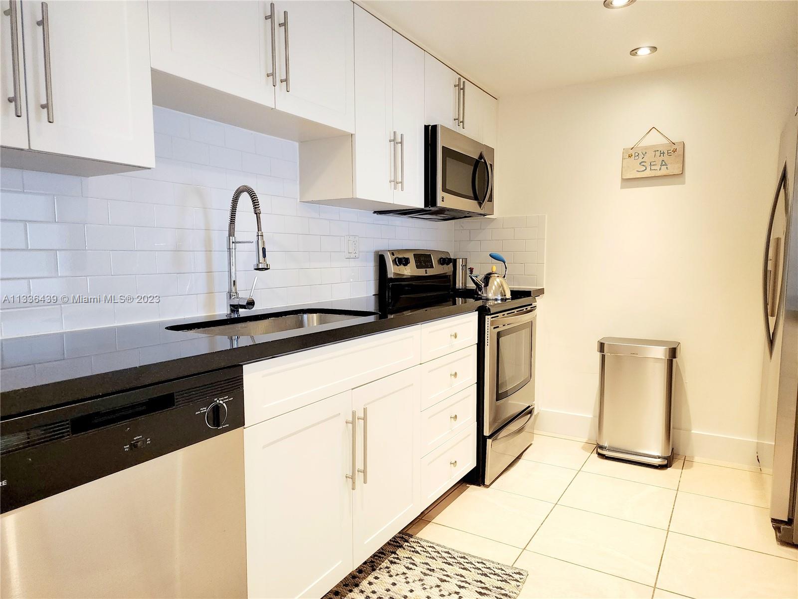 Enjoy Key Biscayne! A unique Salty lifestyle that offers great water sports and boating, State Parks, mountain bike trails, friendly people, amazing cafes and shopping. It is the perfect location for anyone who enjoys the Island Life. Renovated townhouse tiled throughout, open living spaces and additional storage spaces outside the enclosed screened patio. 2BD/2BA upper level, main room has walk-in closet and wall to wall closet, dual vanities and balcony, while entrance level consists of powder room, family/dining, living room, laundry (washer/dryer), kitchen with stainless steel appliances and granite counters.  Assigned parking space, community pool and private beach access just 1/2 block away.