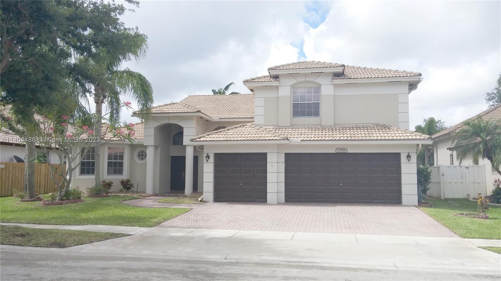 Beautiful two-story four bedroom plus den house in very desirable Pembroke Falls. Screen-enclosed heated swimming pool and patio deck. Gorgeous kitchen with granite countertops and stainless steel appliances. Three car garage. Master bedroom downstairs with views of the pool. Pembroke Falls is a "resort style" gated community with security patrols. Community's clubhouse includes a banquet room, gym, aerobics room, heated community pool, jacuzzi, three lit basketball courts, six lit tennis courts, two lit tennis/pickleball courts, community events and much more. Rent includes HOA provided internet, cable TV and alarm monitoring. Pembroke Falls is conveniently located near parks, retail areas, hospitals, schools and I-75 access.