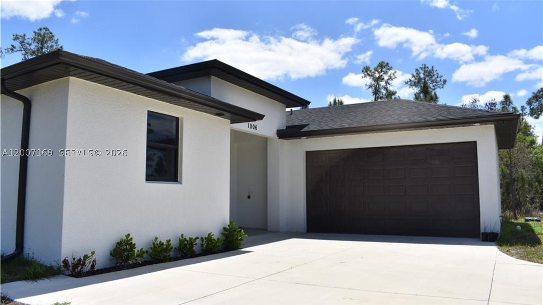 ANNUAL RENTAL-LEHIGH ACRES, FL- Beautiful new construction home at 1006 Hamilton Ave, Lehigh Acres, FL featuring 3 bedrooms plus a den, 2 bathrooms, and a 2-car garage on a spacious 1/2-acre lot in Lehigh Acres. Open-concept layout with modern finishes and natural light. Kitchen flows into the main living area — perfect for entertaining. Flex space ideal as home office or guest room. In-residence laundry with washer, dryer, and utility sink. Oversized lot offers endless outdoor potential. Easy access to major roadways, shopping, and dining. A perfect primary residence or investment opportunity. Schedule your private showing today!
