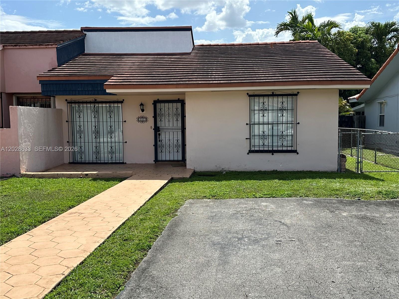 Excellent location & great opportunity to own this 2 bedroom, 2 bath townhome with NO ASSOCIATION. It offers a spacious kitchen with a peninsula & seating area, newer roof installed in 2020, Trane AC, stacked washer & dryer, covered terrace, & spacious backyard. Full of potential & warmth, this inviting property is ready for you to add your personal touch & make it truly feel like home. Conveniently located near Florida International University, many restaurants, shopping centers, and major expressways. It will not last.
