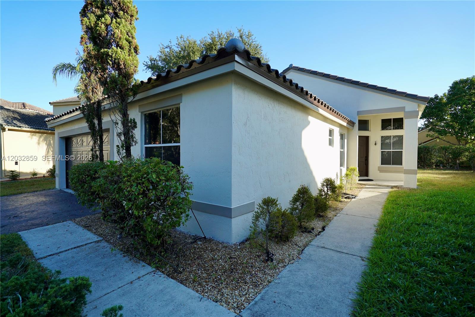 Upgraded home in Weston's North Lakes community that offers 3 bedrooms, 2 baths, and a 2 car garage on an oversized pie-shaped lot with a spacious backyard. Oak wood flooring in all living spaces and bedrooms and gorgeous wood crown molding throughout the home with no popcorn ceilings. New roof, fresh new paint, and a modern kitchen with elegant quartz countertops and new LG cafe appliances. New LG Truestream washer & dryer set with pedestal included, along with a grill and fire-pit in the backyard. This gated community is zoned for the top schools in Broward County and walking distance from the award-winning Eagle Point Elementary. The exterior has been freshly painted a beautiful edgecomb gray. FURNISHED OPTION AVAILABLE