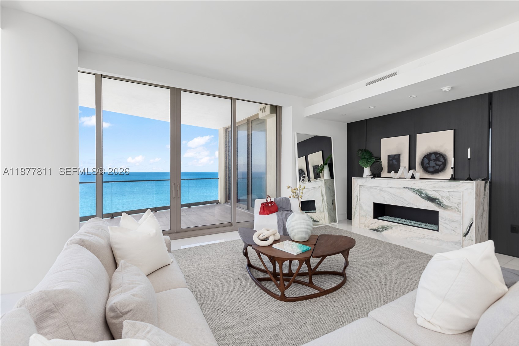 "Extraordinary value awaits at this high-rise residence in Acqualina Estates, Sunny Isles Beach, FL. This four-bedroom plus staff quarters, five-bathroom condo delivers oceanfront living — submit your offers today. The custom Molteni kitchen features a sprawling island and premium appliances, including a built-in dishwasher and gas range. Sunlit living spaces are framed by floor-to-ceiling glass, filling each room with natural light and showcasing breathtaking flow-through views. More amenities await than you could enjoy in one day: lap swimming in the heated pool, workouts in the gym, and rounds in the boxing ring. Billiards, golf, and an ice rink round it out. Avra and Il Mulino complete the picture — any and all serious offers welcome."