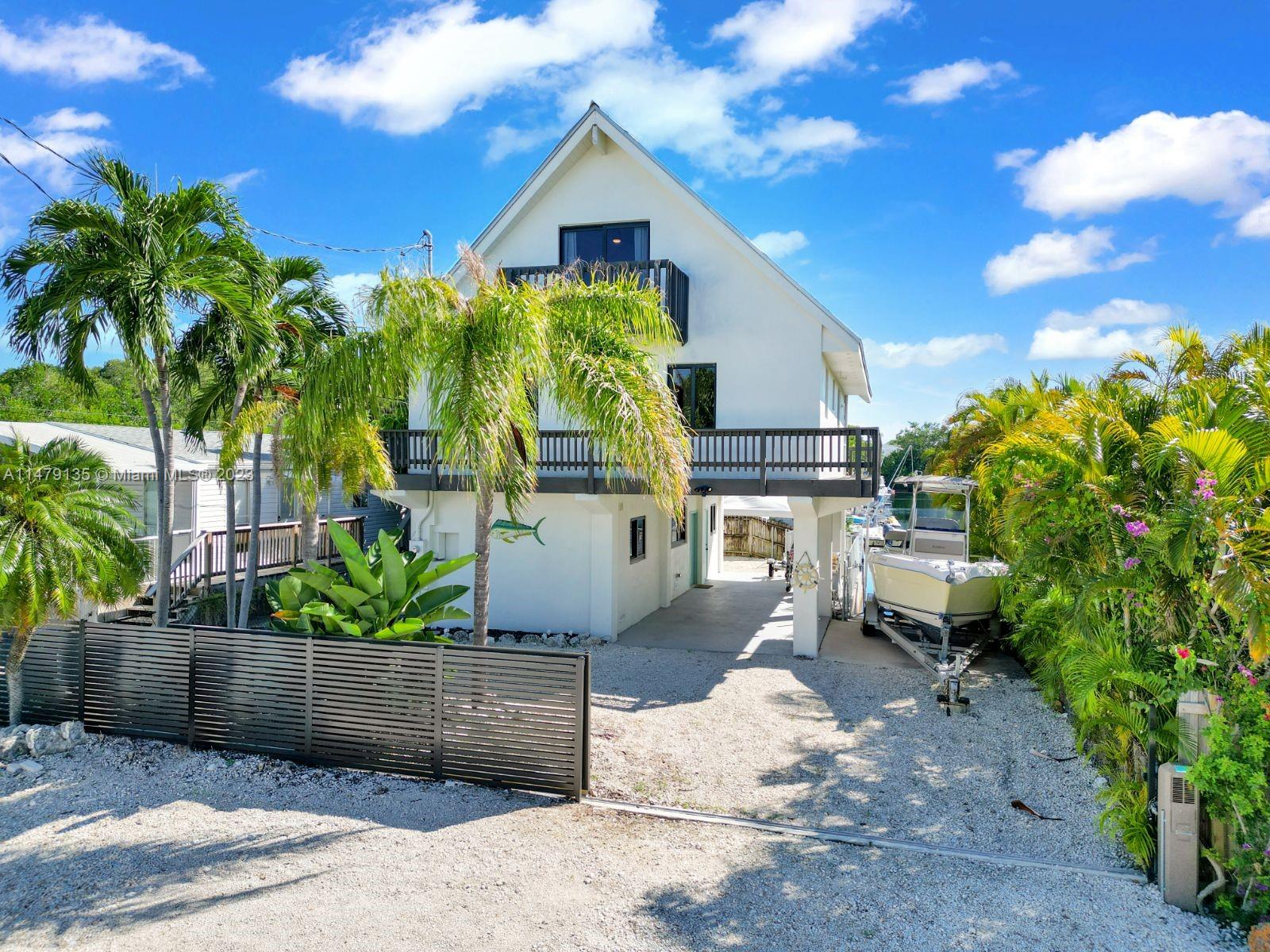 Nestled in Key Largo on MM 106, this beautifully 2021 renovated 2-story waterfront home offers the perfect blend of coastal charm and modern luxury. Located right on the water, this property boasts breathtaking views and direct access to the pristine Florida Bay. The layout is designed for comfortable living featuring 4 bedrooms + loft and 2 full baths. This property comes with a deeded private boat ramp and there is a community boat launch area for larger boats. You can explore the crystal-clear waters of Florida Bay right from your doorstep, indulge in fishing, or take your boat to the open waters. Virtual Tour available upon request.