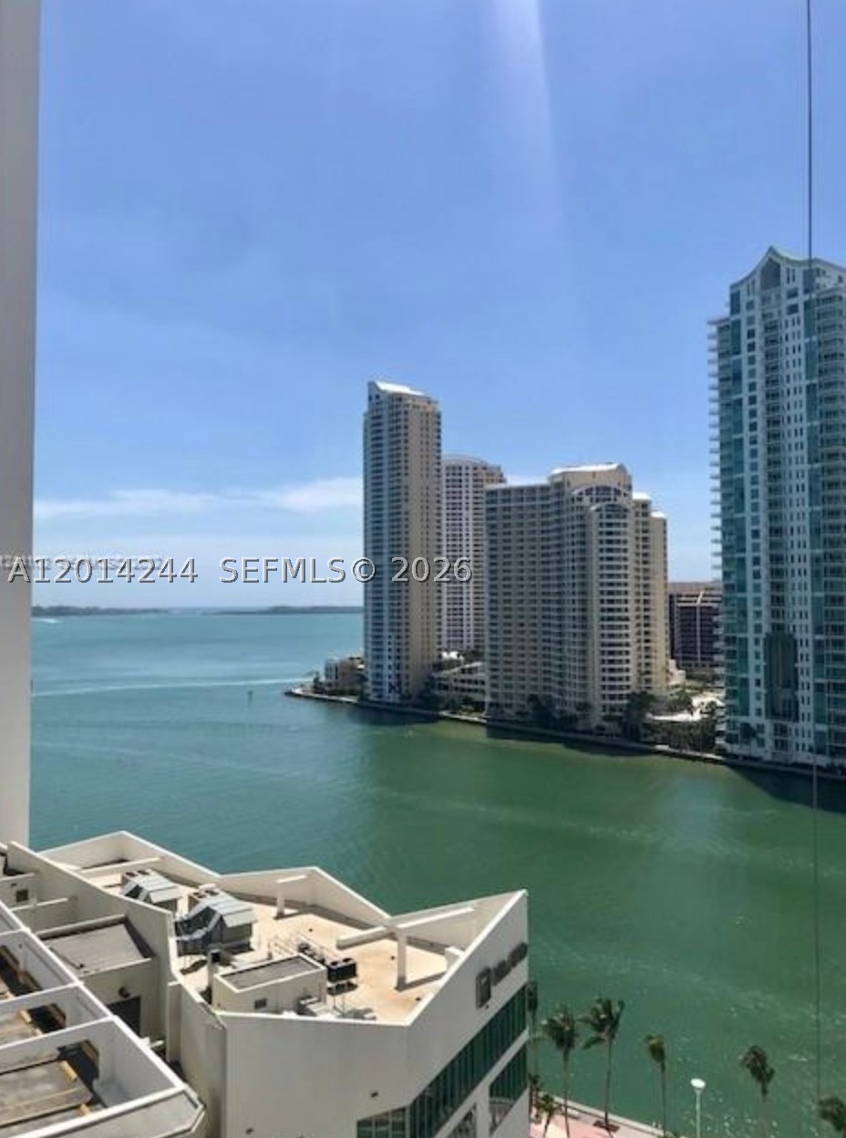 Loft-style residence with stunning bay views. This spacious 1-bedroom, 1.5-bath unit features white tile floors throughout, Italian cabinetry, granite countertops, and stainless steel appliances, including an in-unit washer and dryer. One assigned parking space.
