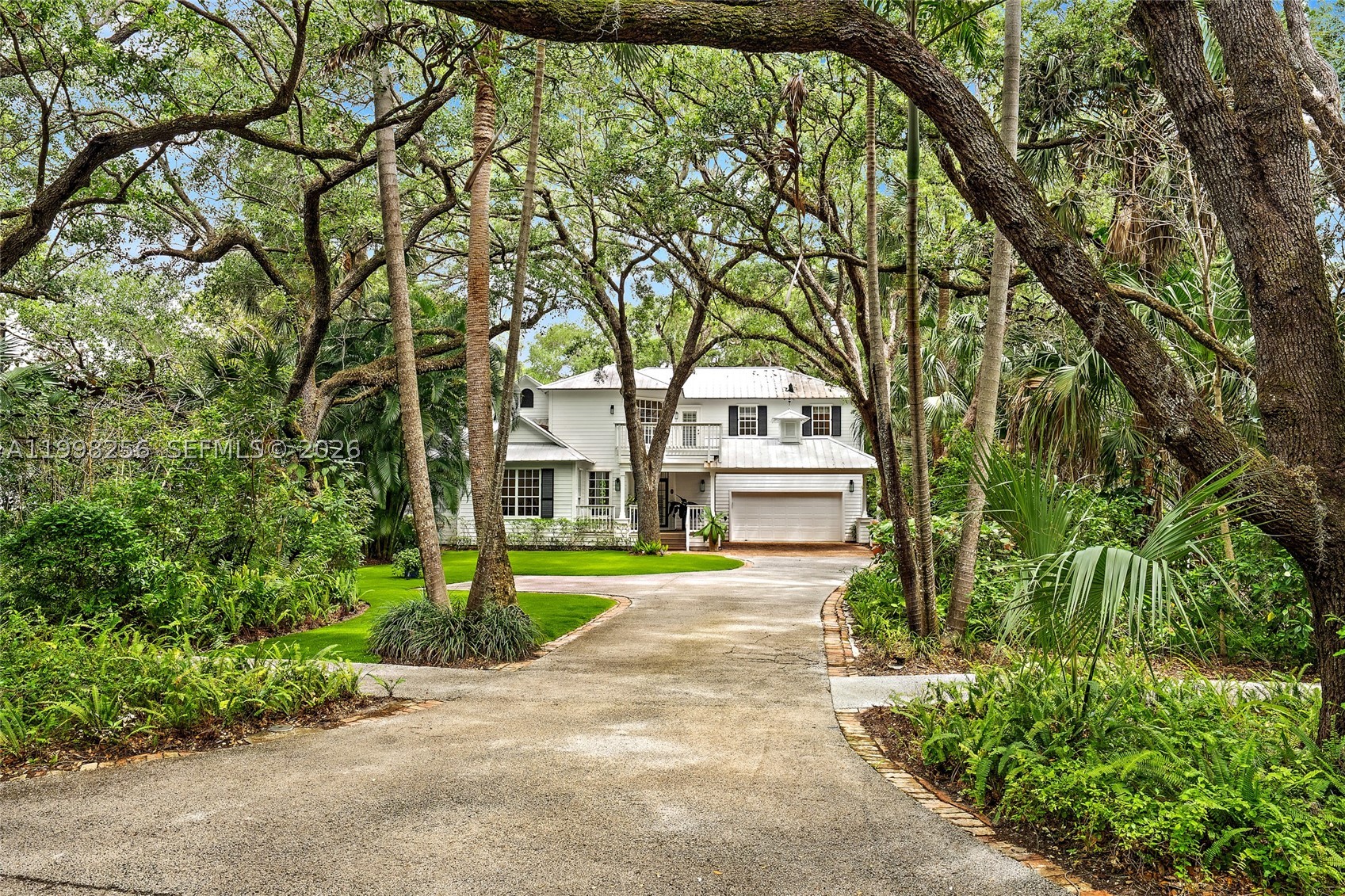Tucked within Nature's Hideaway, a private gated enclave of just 17 homes, this bespoke preserve community offers a setting that feels straight out of a postcard, with mature landscaping and a truly serene atmosphere. This beautifully updated residence is light, bright, and thoughtfully designed, featuring an open-concept layout and expansive windows that fill the home with natural light. The kitchen flows seamlessly into the main living areas, creating an ideal space for both everyday living and entertaining.