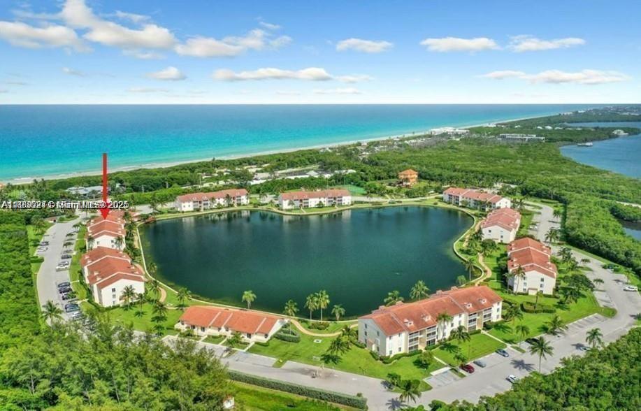 Walk across the street to the beach! Immaculate, fully furnished condo with new appliances (refrigerator, oven and dishwasher in 2023, AC unit in 2024). This home features a cathedral ceiling with skylight, newly screened lanai, hurricane shutters and tiled floors. No carpet. Second closest building to the pool & the beach. Pond views from the primary bedroom and a massive walk-in closet. Can come furnished or unfurnished. Move in ready for those interested in buying for a primary or secondary residence. Amenities include a clubhouse, tennis, pickleball, bocce, shuffleboard, large heated pool and hot tub plus Lakeside grills and tables. A true Island Resort!