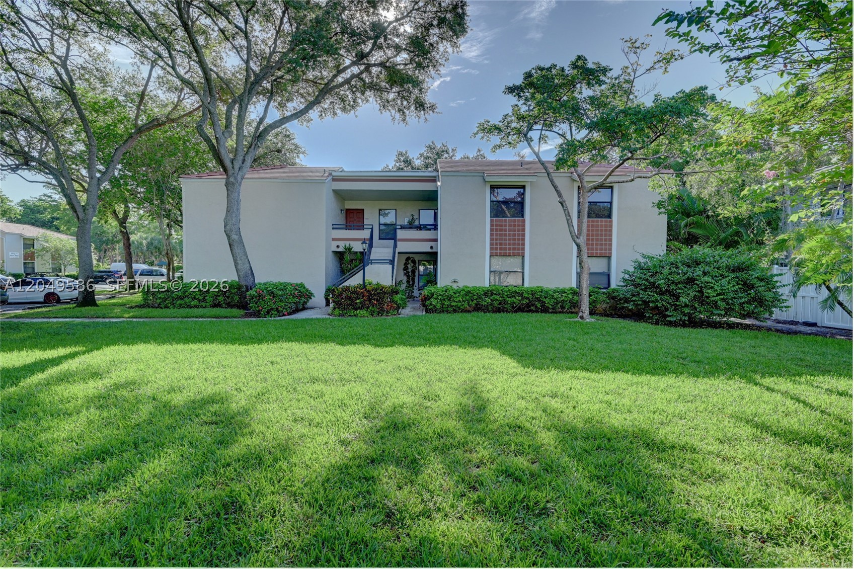 Excellent location in sought after QUATRAINE AT JACARANDA. Beautifully updated private unit on second level. New modern flooring. Updated kitchen with Granite counter tops. Custom closet cabinetry in both walk in closets and hallway. Tranquil view from all rooms. Full size washer and dryer. Nearby parks and restaurants. Short drive to Sawgrass Mall.