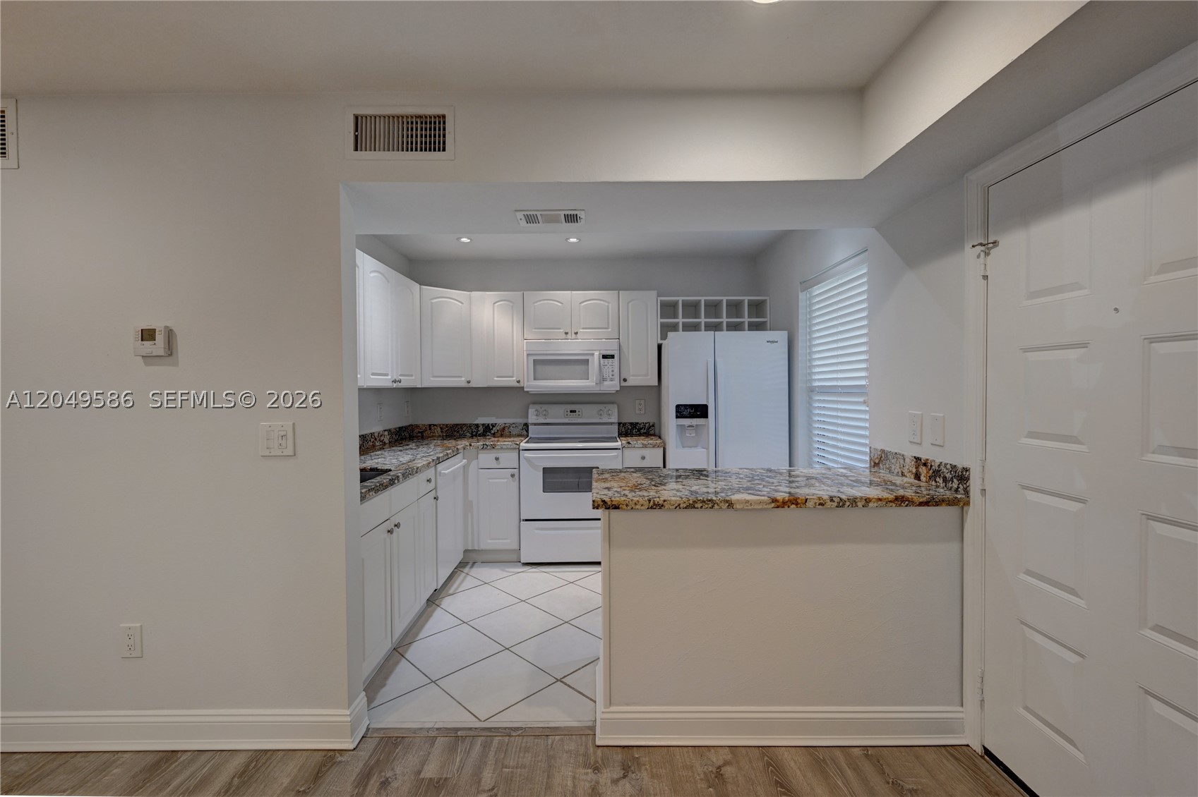 Excellent location in sought after QUATRAINE AT JACARANDA. Beautifully updated private unit on second level. New modern flooring. Updated kitchen with Granite counter tops. Custom closet cabinetry in both walk in closets and hallway. Tranquil view from all rooms. Full size washer and dryer. Nearby parks and restaurants. Short drive to Sawgrass Mall.