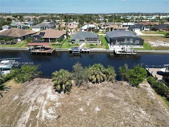 Discover the perfect location to build your dream home in Southwest Cape Coral, Florida. This oversized .36-acre vacant lot offers DIRECT sailboat water gulf access with no bridges and is situated in a neighborhood of newer homes. With its convenient location close to shopping, schools, parks, and restaurants, this lot provides the perfect balance of convenience and tranquility. Design and build the home of your dreams in a premium location with direct access to the Gulf. Don't miss out on the opportunity to make your dream home a reality. Contact us today to schedule a viewing, or just take a drive by and discover the limitless potential of this stunning vacant lot in one of the most desirable areas of Cape Coral! Seawall installed.