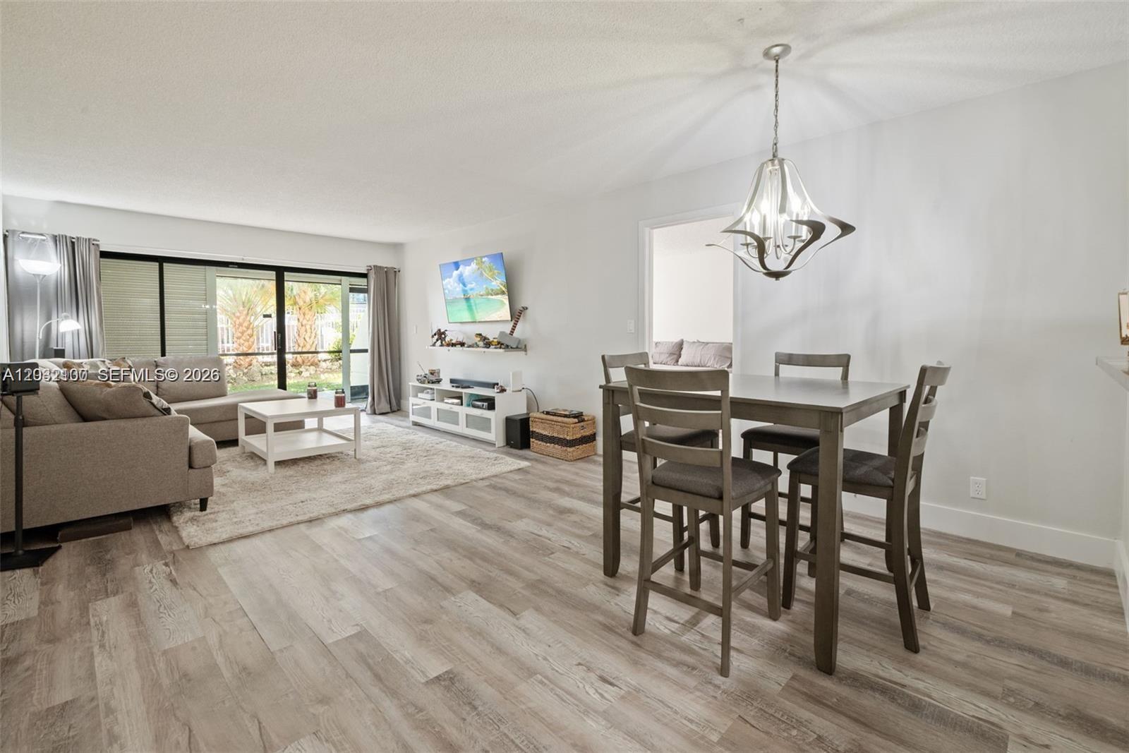 This rarely available and tastefully renovated *First Floor* 2 bedroom, 2 bathroom Weston condo is a true gem!! Located in the prestigious community of Weston this is one of the few condo locations available within the city. Thoughtfully upgraded this condo features a new kitchen, new flooring throughout, new master bathroom, fresh paint, new lighting, baseboards, and much more! A full size washer and dryer right in the unit and an additional storage space is also provided! A sparkling pool is just steps away from your private patio! The HOA includes water, sewer, garbage, and exterior insurance! The building was recently painted, waterproofed, a beautifully updated lobby, brand new elevator, and FPL replaced all parking lot lights with LED's. Opportunities like this are rare and this condo will not last!!