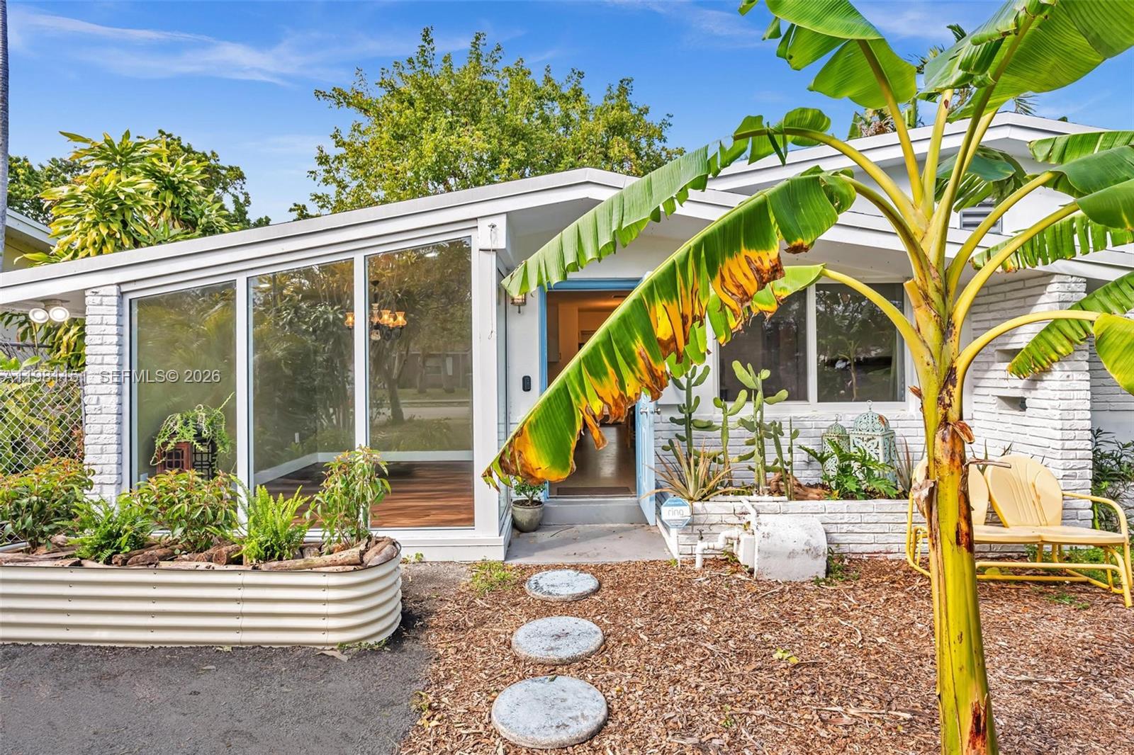 Located 1.5 miles to downtown Hollywood, 2 miles to Gulf Stream, and 3 miles to the beach, this tropical oasis is in the heart of it all. Boasting a tropical food forest, kick back and relax in the coastal breeze as you enjoy fresh home grown mango, star fruit, dragon fruit, plantain, banana, loquat, sapadillo and more. This home features 3 bedrooms, 2 bathrooms, new roof 2022,  new HVAC 2022, new IMPACT windows and storefront 2023, new electrical and water heater. Great energy.