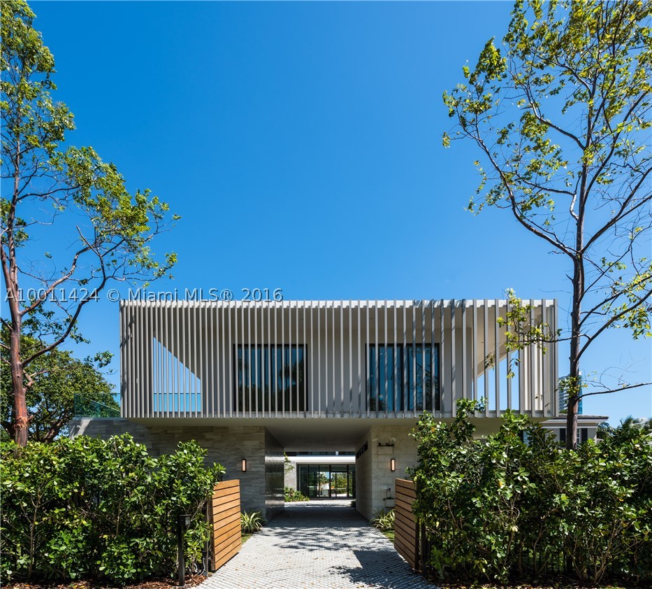 Private Island, New contemporary home designed by Domo Architecture and developed by Todd Michael Glaser.  On a 17,280 SF lot with 80 ft of water front. The home has 8,500 SF of interior space. 8 beds, 8 full bath, 2 half bath, gourmet kitchen, media room, elevator, master sitting room, koi pond, outdoor shower, heated pool/spa. guest house and main house are separate with 2 car garage.