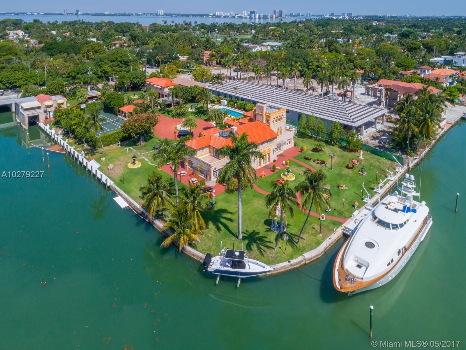 One of Miami Beach's most iconic estates and the Jewel of Pine Tree Drive! This classic Mediterranean estate is situated on 2 acres with approximately 560ft of frontage on the Indian Creek Waterway. Estate is comprised of a three-story main house, a guest/theater/garage complex, and one of the last remaining boathouses on Miami Beach. Lighted tennis courts and expansive manicured grounds abound. Ample deep-water dockage for a mega-yacht and multiple vessels. A rare opportunity!