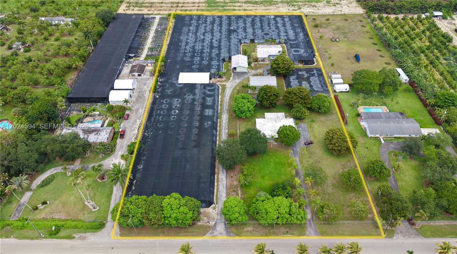 LOCATION, LOCATION, LOCATION. 5 ACRE FULLY FENCED (REMOTE GATE ACCESS) REDLAND COMPOUND CONSISTING OF 2 HOMES,2 LARGE METAL WAREHOUSES, APPROXIMATELY 3 ACRES OF SHADE HOUSE AND DIESEL IRRIGATION SYSTEM. EACH HOME HAS 4 BEDROOMS,2 BATHROOMS AND SCREEN LANAI TO ENJOY THE BEAUTIFUL ACREAGE. ONE HOME HAS A 1 CAR CARPORT AND THE OTHER HOME HAS AN ATTACHED 2 CAR  GARAGE. LOVELY PRIVATE AND DESIRABLE LOCATION IN THE REDLANDS. MINUTES FROM MIAM, FL KEYS, FLAMINGO AND EVERGLADES NAT'L PARK, BISCAYNE NAT'L PARK FPL TURKEY POINT AND MORE. GREAT LOCATION FOR KROME AVE COMMUTING TOO!