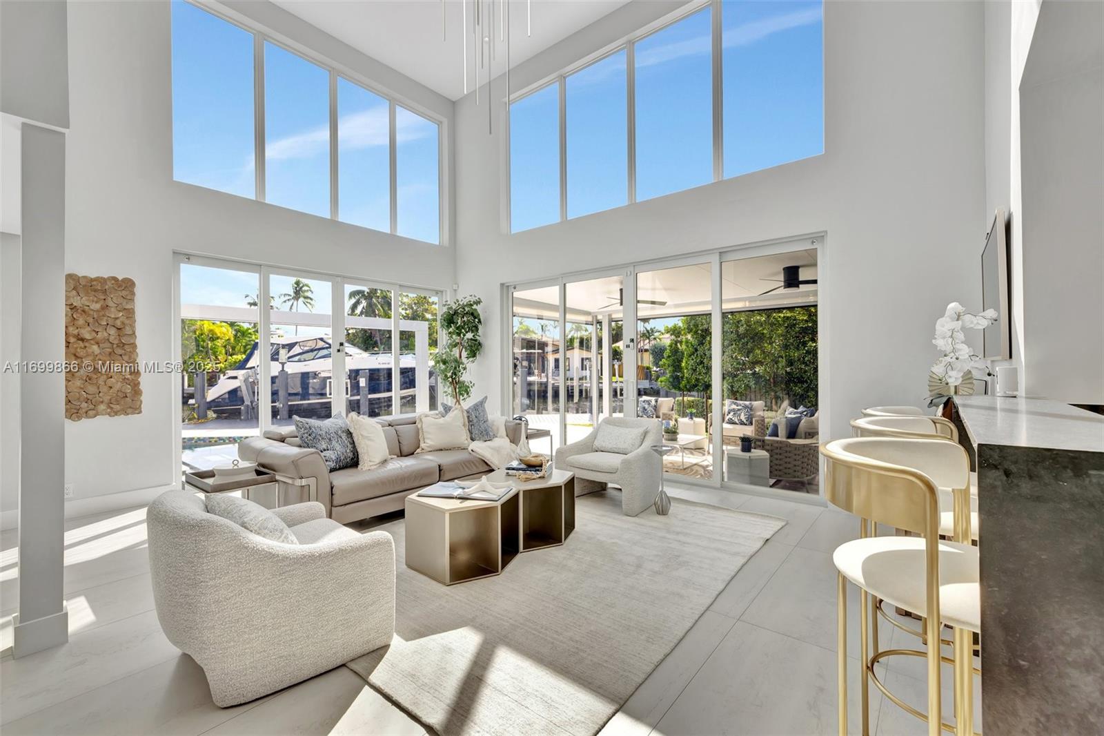This waterfront home w/Ocean access (80ft/40k lb Boat Lift) is situated minutes from golden sand & sparkling turquoise waters of Fort Lauderdale Beach. This beautifully remodeled modern home is designed to give you the world class lifestyle you deserve. This premier estate has 5 bedrooms, 5 1/2 unique bathrooms. Wonderful entertaining area w/summer kitchen, resort style pool w/tanning shelf, waterfall, large hot tub w/beautifully landscaped grounds & water views. Fully equipped chef’s kitchen with Butler's pantry.  Separate bar & entertainment area. Master suite has spa-like bathroom w/separate water closet, free standing soaking tub and multi person shower w/two rain shower heads. All bedrooms have full en suite baths. This home is fully protected with hurricane impact Windows & Doors.