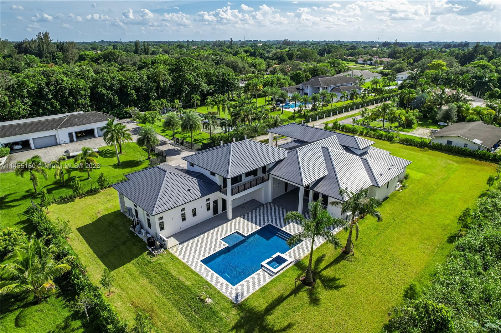 WELCOME TO PARADISE! *NO HOA* BRAND NEW, MOVE-IN READY ESTATE LOCATED IN THE HEART OF DAVIE, FL. FEATURES 4 CAR GARAGE, FRONT DRIVEWAY FOR UP TO 15 CARS, 6 BEDROOMS, 7.5 BATHROOMS, LARGE TERRACE OVERLOOKING THE POOL, SUMMER KITCHEN/BAR, TOP OF THE LINE STAINLESS STEEL APPLIANCES + CUSTOM DESIGNED FINISHES. MASTER BEDROOM INCLUDES FULL SUITE STYLED BAR, CUSTOM-BUILT WALK-IN CLOSET AND ACCESS TO THE POOL. ADDITIONALLY, THE HOME COMES WITH LARGE, FULLY EQUIPPED GUEST HOUSE COMPLETELY SEPARATE FROM THE HOME. IN THIS MAGNIFICENT LAYOUT THERE IS ROOM FOR ENDLESS POSSIBILITIES. WHETHER YOU’RE LOOKING TO MAKE A HOME GYM OR THEATER, THE SPACE IS AVAILABLE! ONLY 5 MINUTES FROM THE HIGHWAY AND 10 MINUTES FROM THE HARDROCK GUITAR & AIRPORT + CLOSE TO ALL A+ SCHOOLS. SHOWINGS BY APPOINTMENT ONLY.
