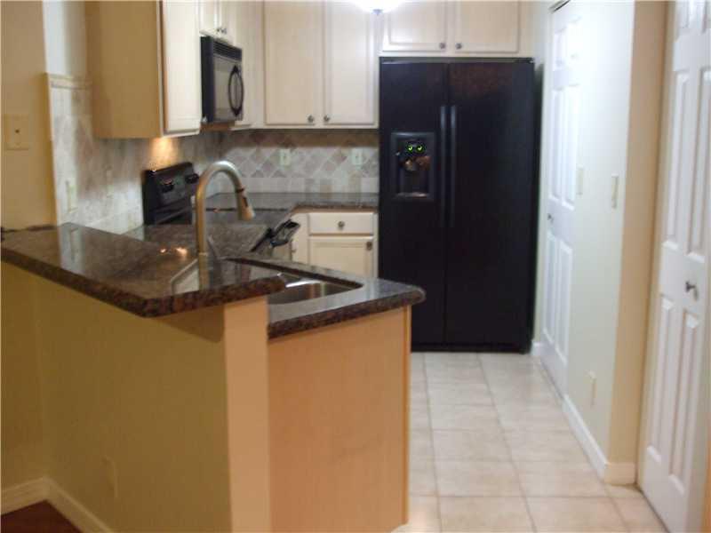 Beautiful 3 BR villa in the Exclusive of Boynton Oasis.Professionally landscaped exterior w/brick paver driveway & sidewalk. completely updated interior with granite counters, newer appliances, wood floors, updated bathes and a new A/C